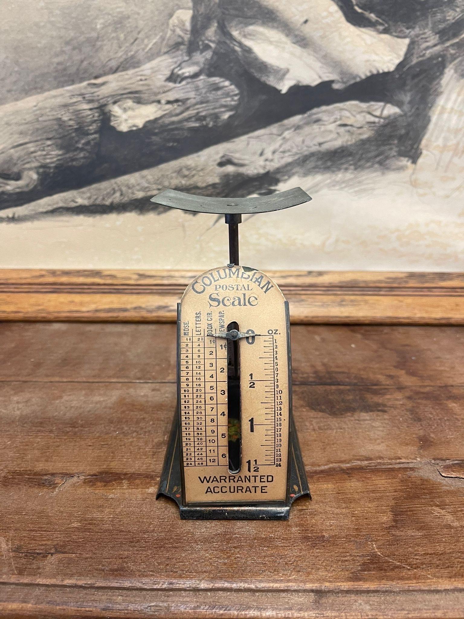 Postal Scale that Weighs items up to  1.5 oz. Beautiful Petina to the Metal and the Label. Floral Motif on the Bottom. Vintage Condition Consistent with Age as Pictured.

Dimensions. 5 W ; 3 D ; 6 H