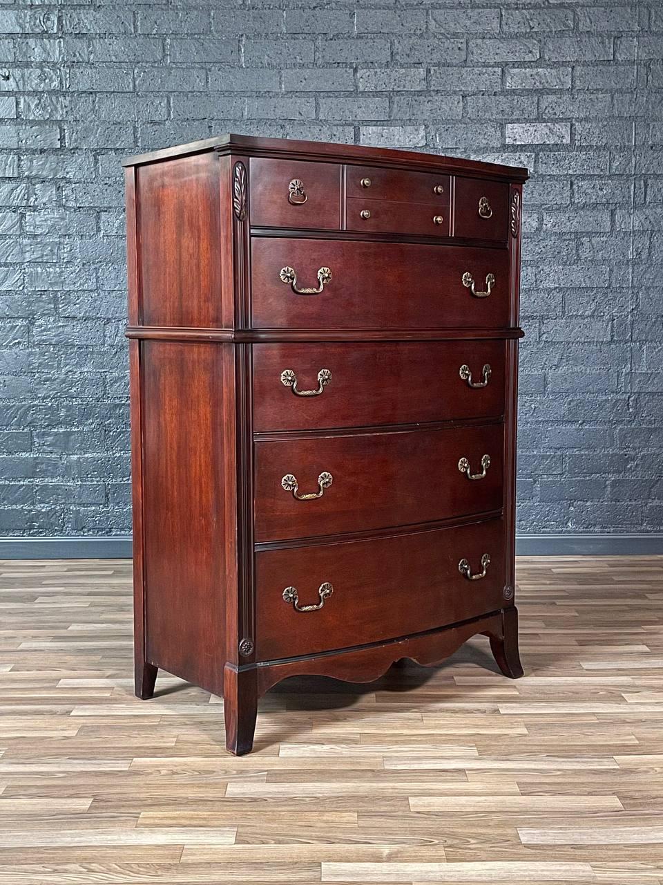 Condition: Original Vintage Condition
Designer: Huntley Furniture
Manufacturer: Huntley Furniture 

Materials: Mahogany, Patinated Brass Handles

Vintage Colonial Revival Highboy Dresser by Huntley Furniture, c.1950s. Made in the United States, this