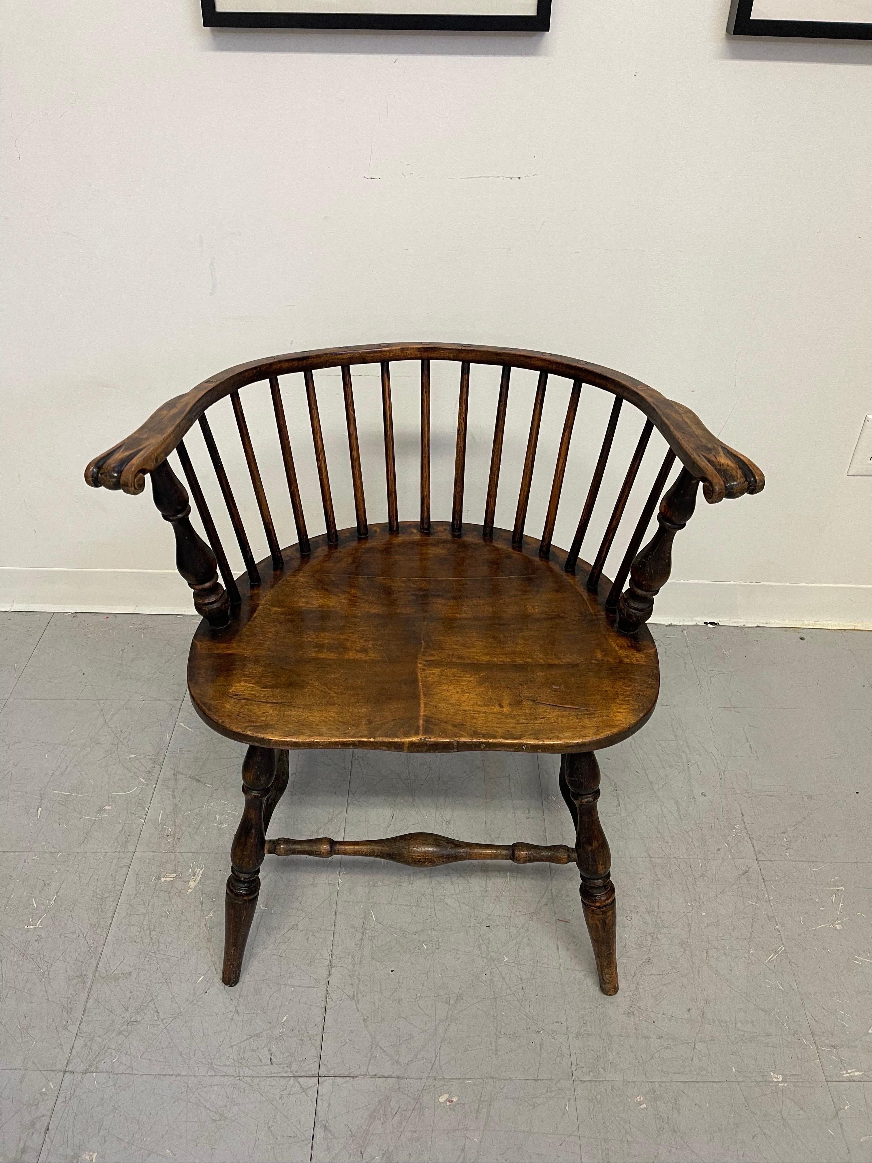 Low Comb Pub Chair. Turned Leg. Rich Petina to the Wood. Claw Carvings at the Edge of Each Arm. Vintage Condition Consistent with Age as Pictured.

Dimensions. 25 W ; 18 D ; 28 H