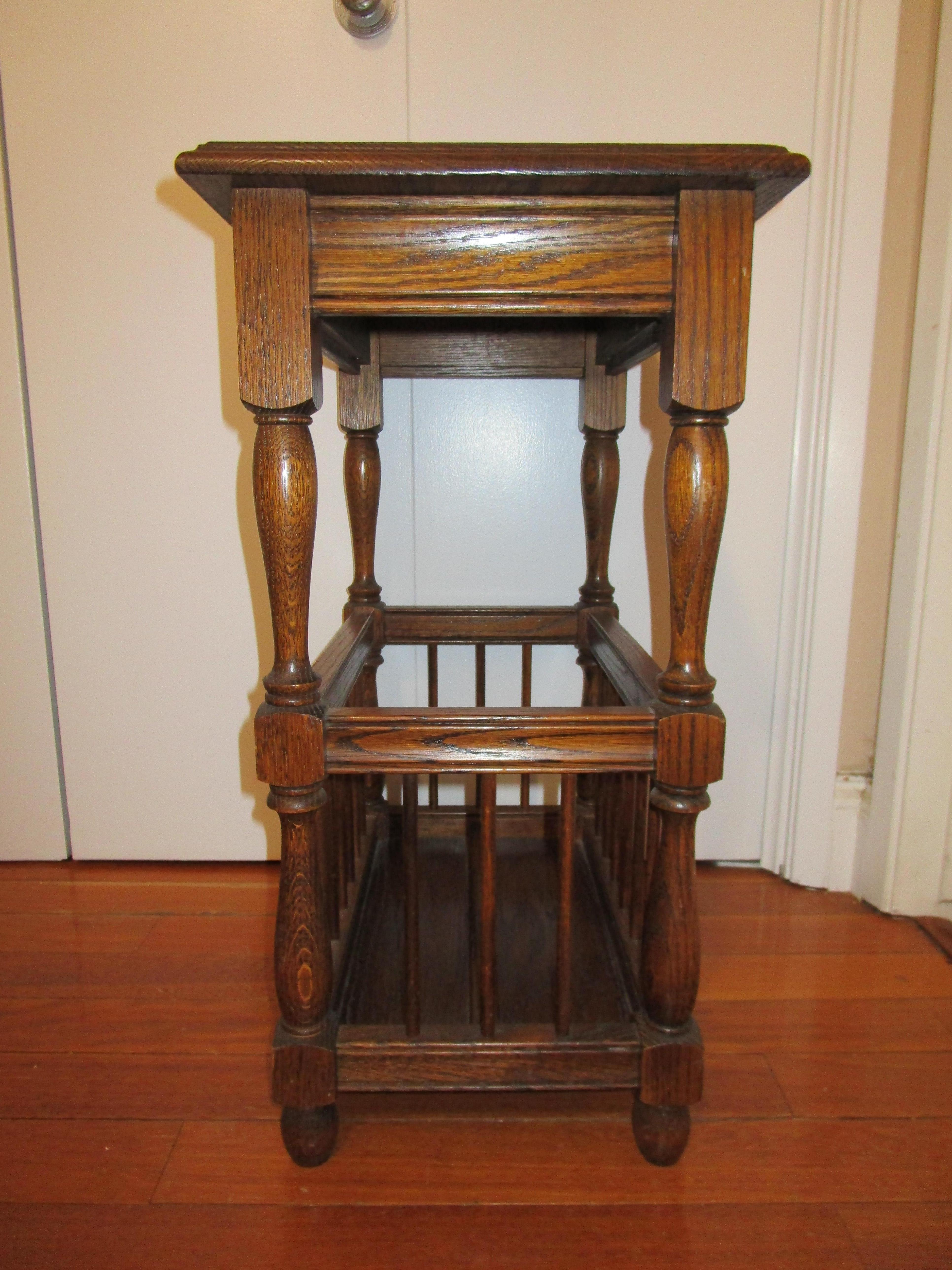 This is a charming occasional piece in the colonial revival style with a functional area for storage or display of culinary or other items, your choice!. It is vintage Colonial turned pine from the mid 20th century. 
The top has a molded edged
