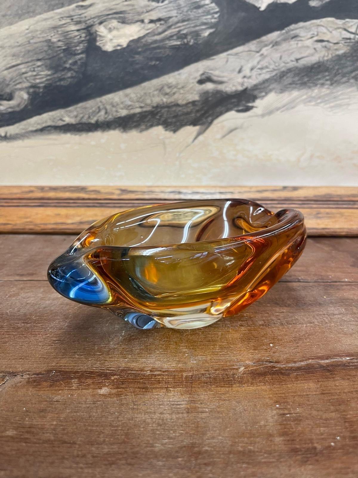 Beautifully shaped Ashtray with orange and blue coloring. No Makers mark. Vintage Condition Consistent with Age as Pictured.

Dimensions. 7 W ; 4 D ; 2 1/2 G