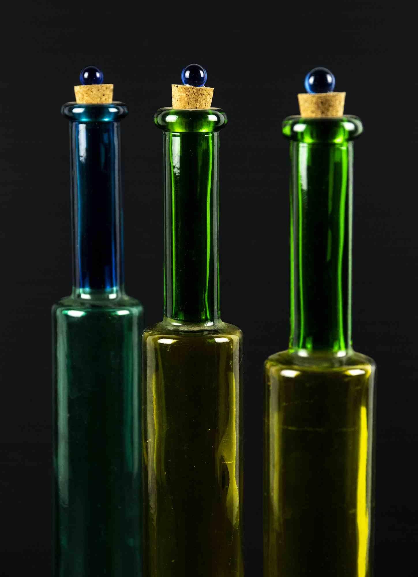 Vintage colored glass bottles is an original decorative object realized in the 1970s.

Original art glass.

Made in Italy.

Dimensions: 37 x 5 cm. 

Perfect conditions.