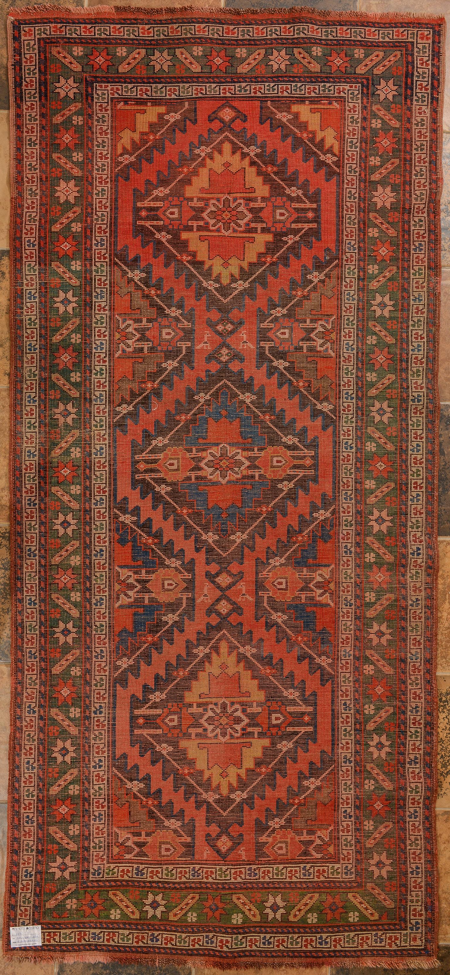 nr. 858 -  Coral pink background with green border for this beautiful Karabagh (or Garebagh) Caucasian carpet -
My carpets are not affected by fashions. After a year the new modern carpets are no longer worth the price paid because the trend has