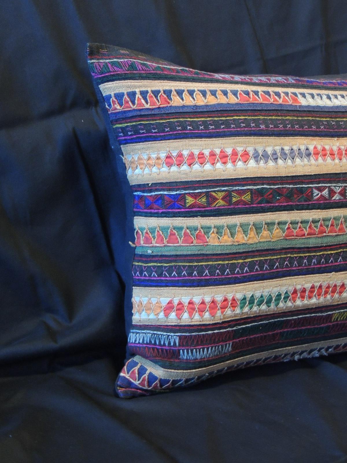 Vintage colorful embroidered Indian silk decorative bolster pillow.
Embroidered and small patchwork pillow with same black raw silk
backing. Zipper closure.
Size: 16 x 19 x 6.