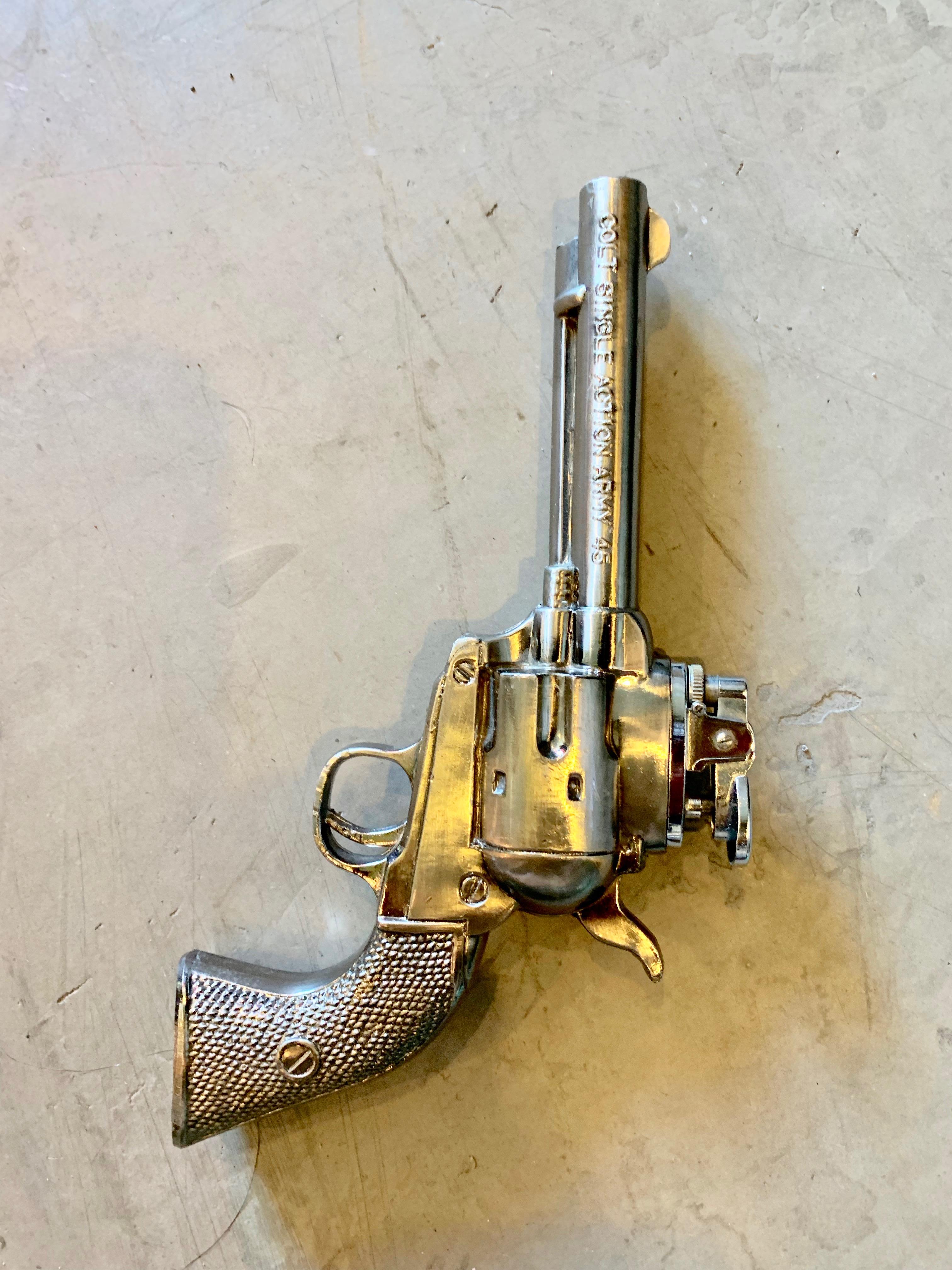 Cool vintage table lighter in the shape of a colt, single action revolver handgun. Made of metal. Made in Japan. Good working condition. Great object.

 