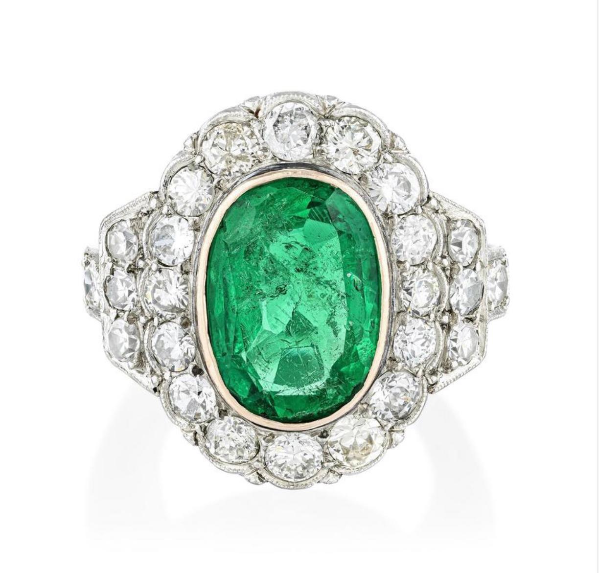 Unparalleled Beauty! 

Vintage Colombian and diamond ring beautifully hand crafted in platinum. 
 The details are as follows : 

Oval faceted emerald weight : 2.45 carat 
Diamond weight : old cut and single cut : 1.05 carat 
Measurements : ring top: