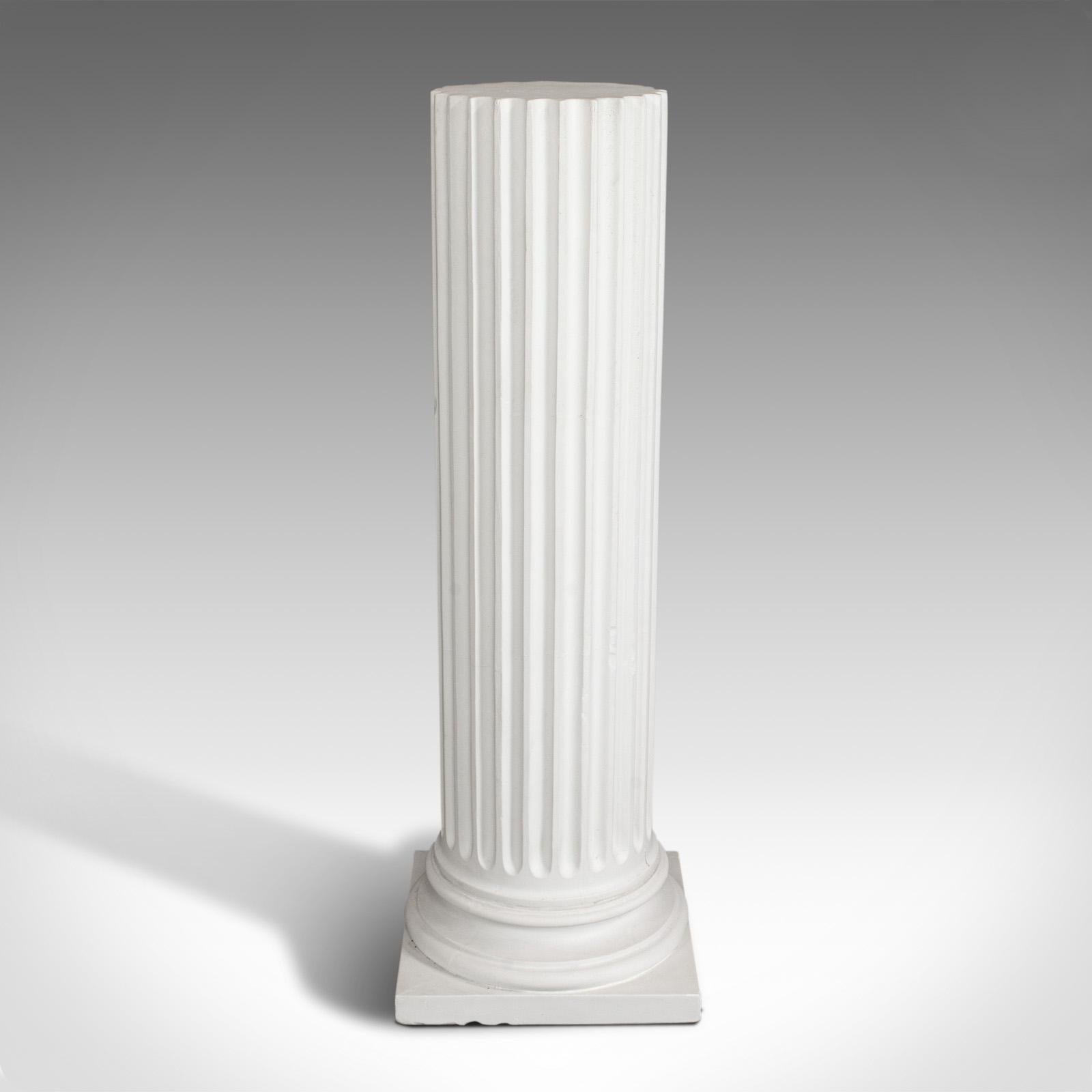 This is a vintage fluted column base. An English, architectural plaster Doric column in classical form, dating to the late 20th century. (Multiple available.)

Attractive, versatile classical revival pillar
Displays a desirable aged patina
Small
