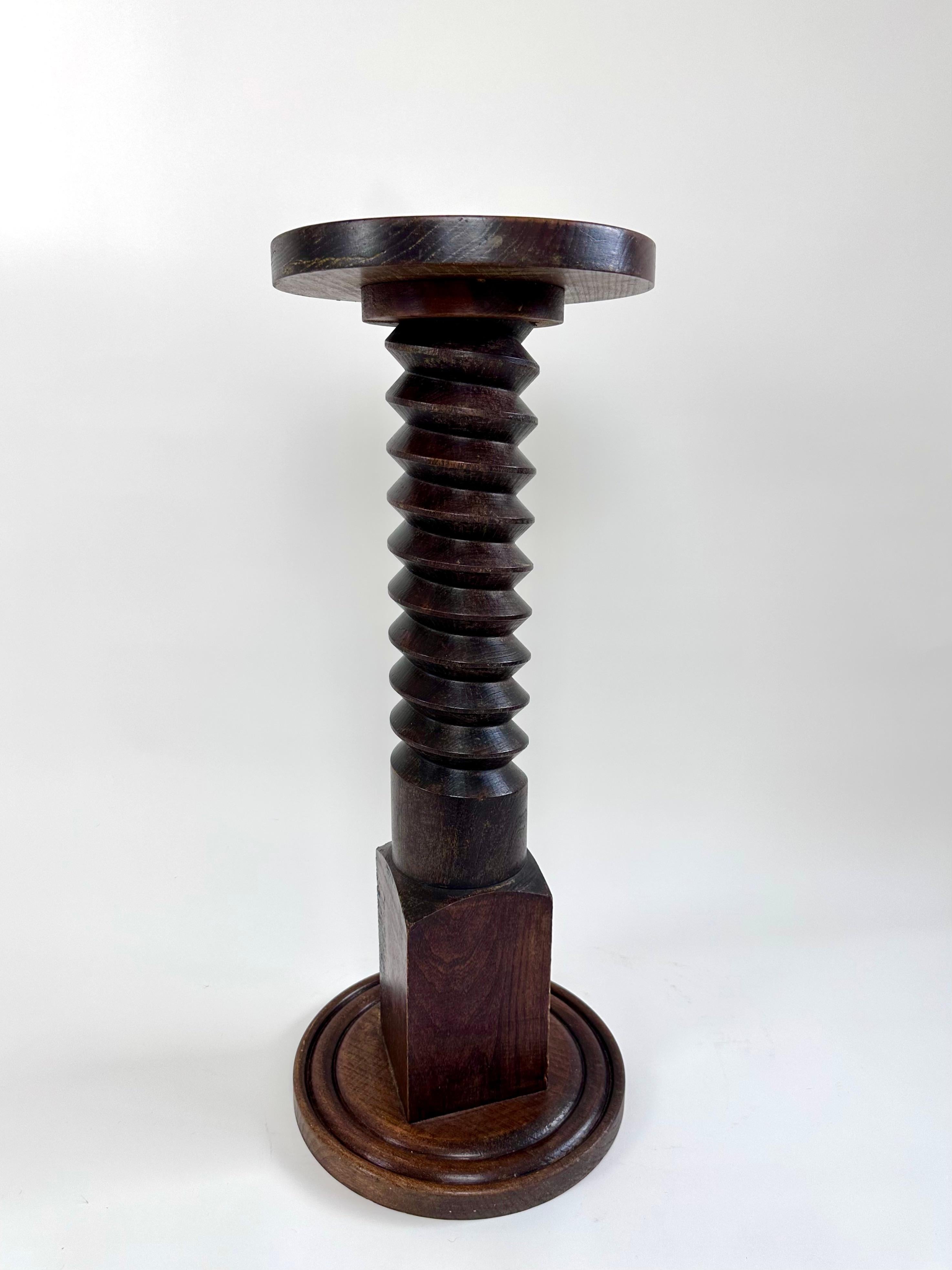 Mid-sized turned oak plinth/pedestal reminiscent of designs by Charles Dudouyt sourced from central rural France.

Dating from the early-mid 20th century.

Wood has a lovely rich colour.

In excellent condition with signs of age but no damage and no