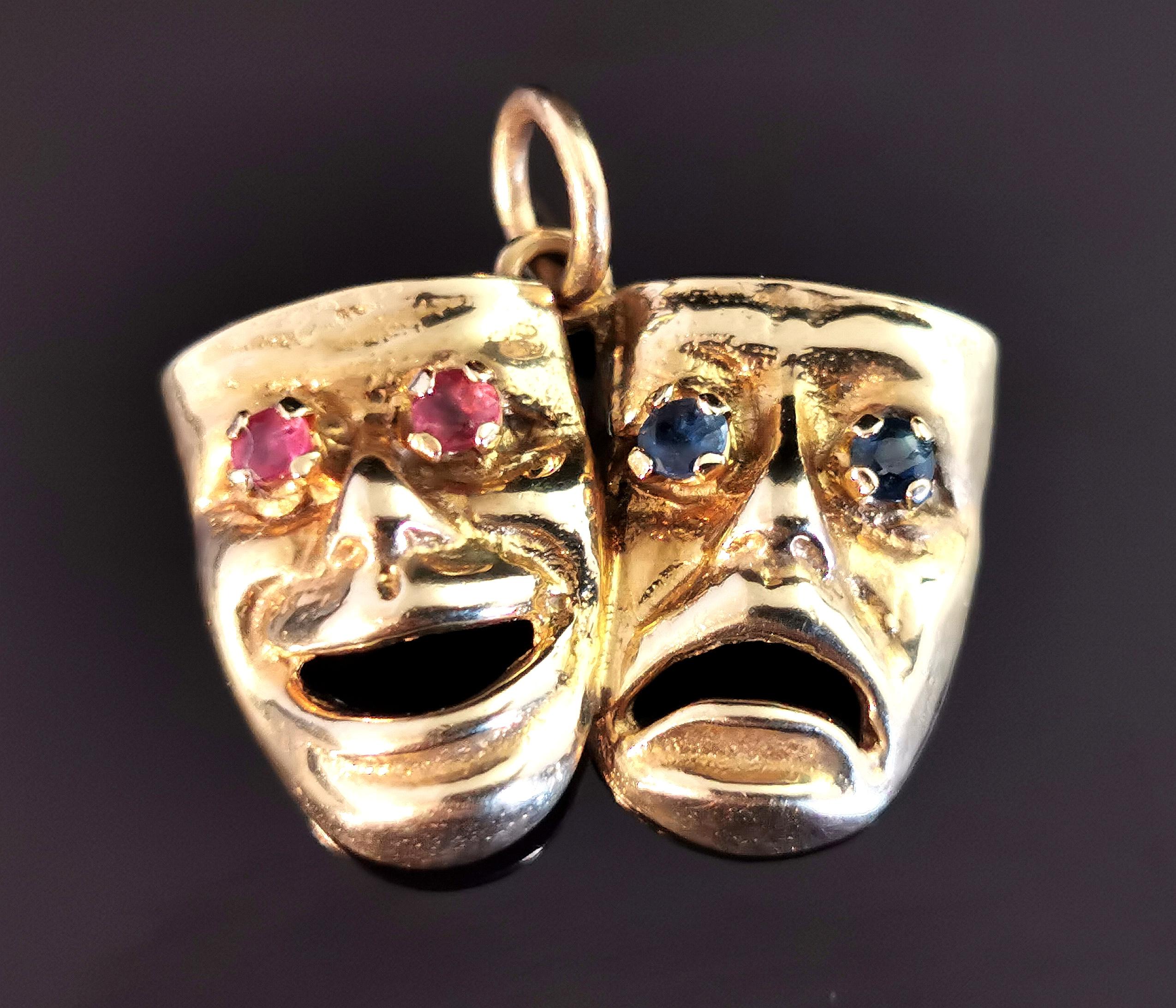 A fun vintage 9kt gold Comedy and Tragedy mask pendant.

This awesome pendant is well designed as the famous Comedy / Tragedy theatrical mask.

The eyes in each mask are set with gemstones with comedy having pinky red rubies and Tragedy blue
