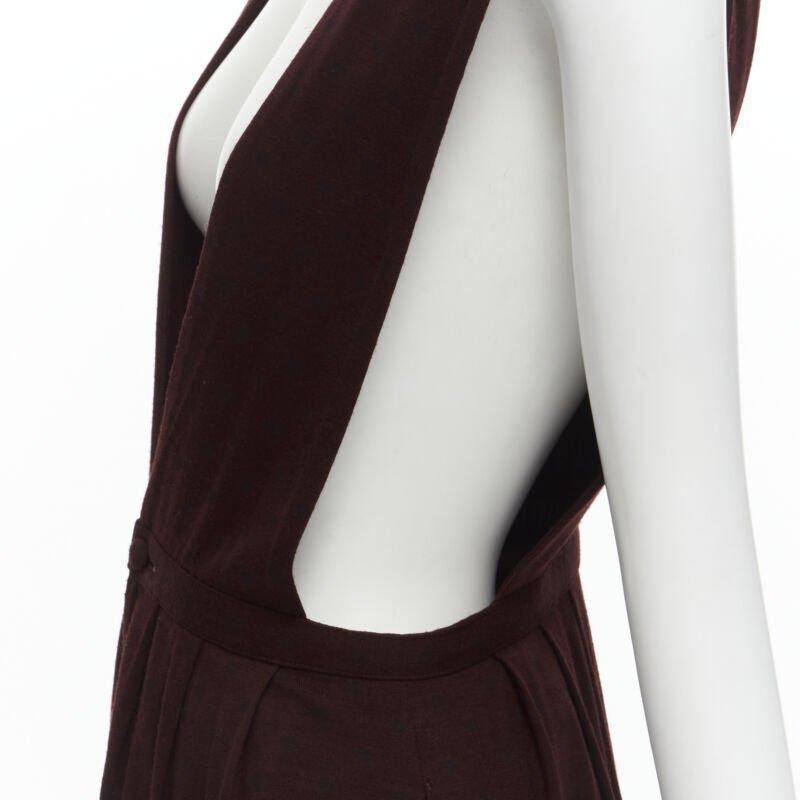 vintage COMME DES GARCONS 1980s burgundy polka dot dungaree midi skirt S
Reference: CRTI/A00453
Brand: Comme Des Garcons
Designer: Rei Kawakubo
Collection: 1980s
Material: Wool
Color: Burgundy, Black
Pattern: Polka Dot
Closure: Zip
Extra Details: