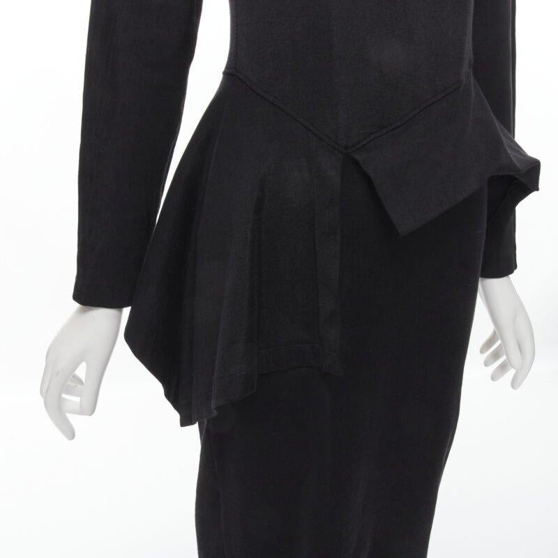 vintage COMME DES GARCONS 1980's mock neck asymmetric peplum midi dress M
Reference: CRTI/A00603
Brand: Comme Des Garcons
Designer: Rei Kawakubo
Collection: 1980s
Color: Black
Pattern: Solid
Closure: Zip
Extra Details: Mock neck. Dropped shoulder
