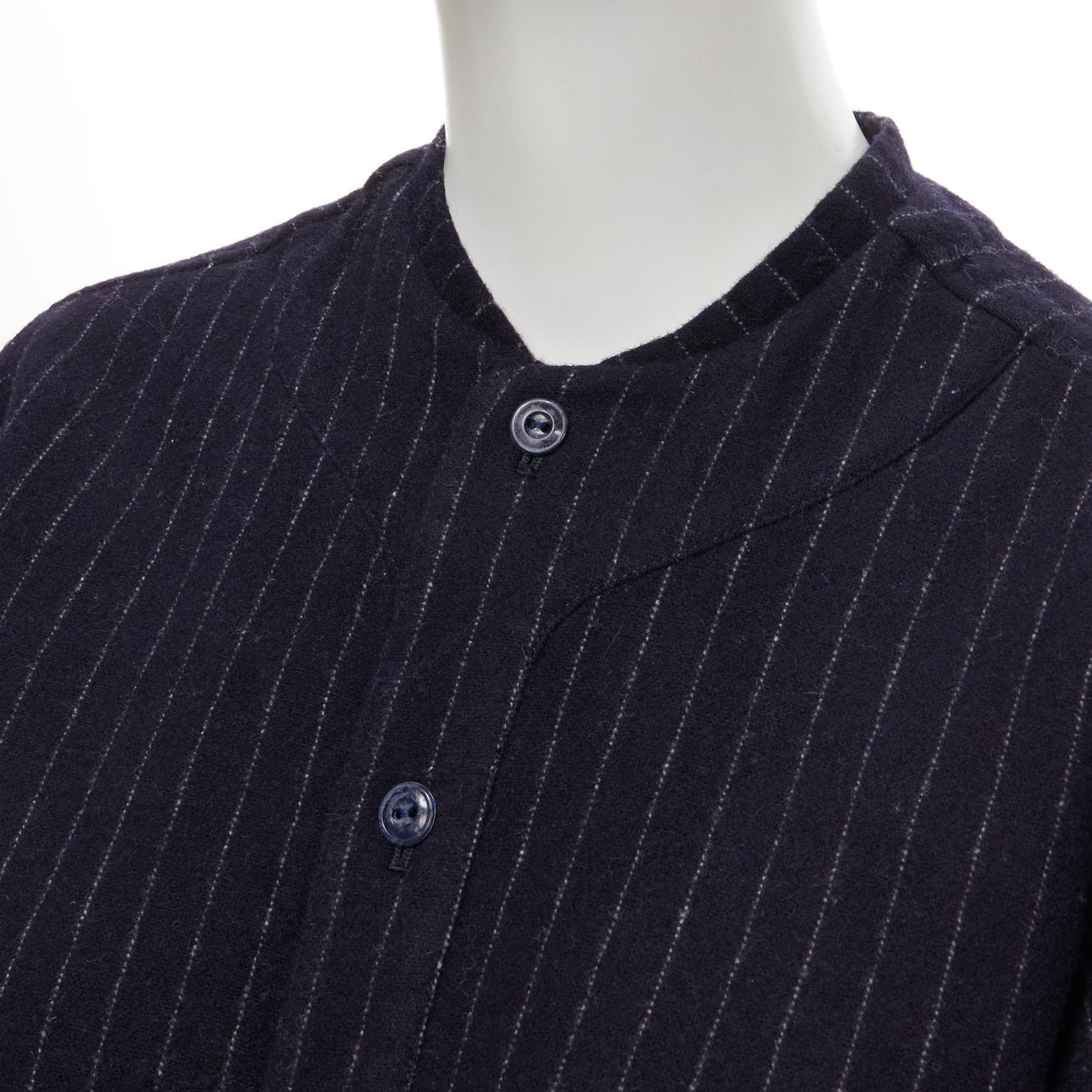 vintage COMME DES GARCONS 1980s navy blue pinstripe wool boxy baseball shirt S 
Reference: CRTI/A00391 
Brand: Comme Des Garcons 
Collection: 1980's 
Material: Wool 
Color: Blue 
Pattern: Striped 
Closure: Button 
Extra Detail: Baseball collar. Vent