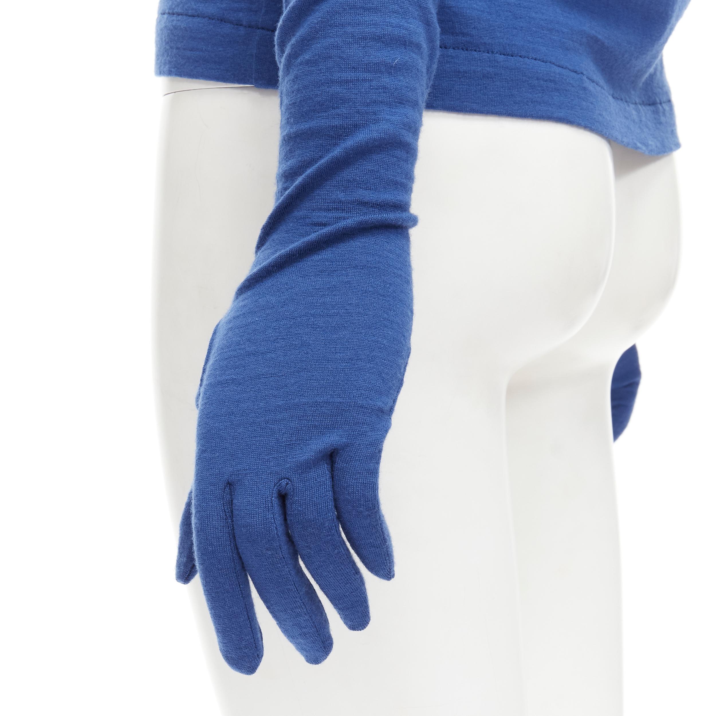 vintage COMME DES GARCONS 1988 cobalt blue wool attached glove t-shirt top M 
Reference: CRTI/A00373 
Brand: Comme Des Garcons 
Designer: Rei Kawakubo 
Material: Wool 
Color: Blue 
Pattern: Solid 
Closure: Button 
Extra Detail: Snap button at