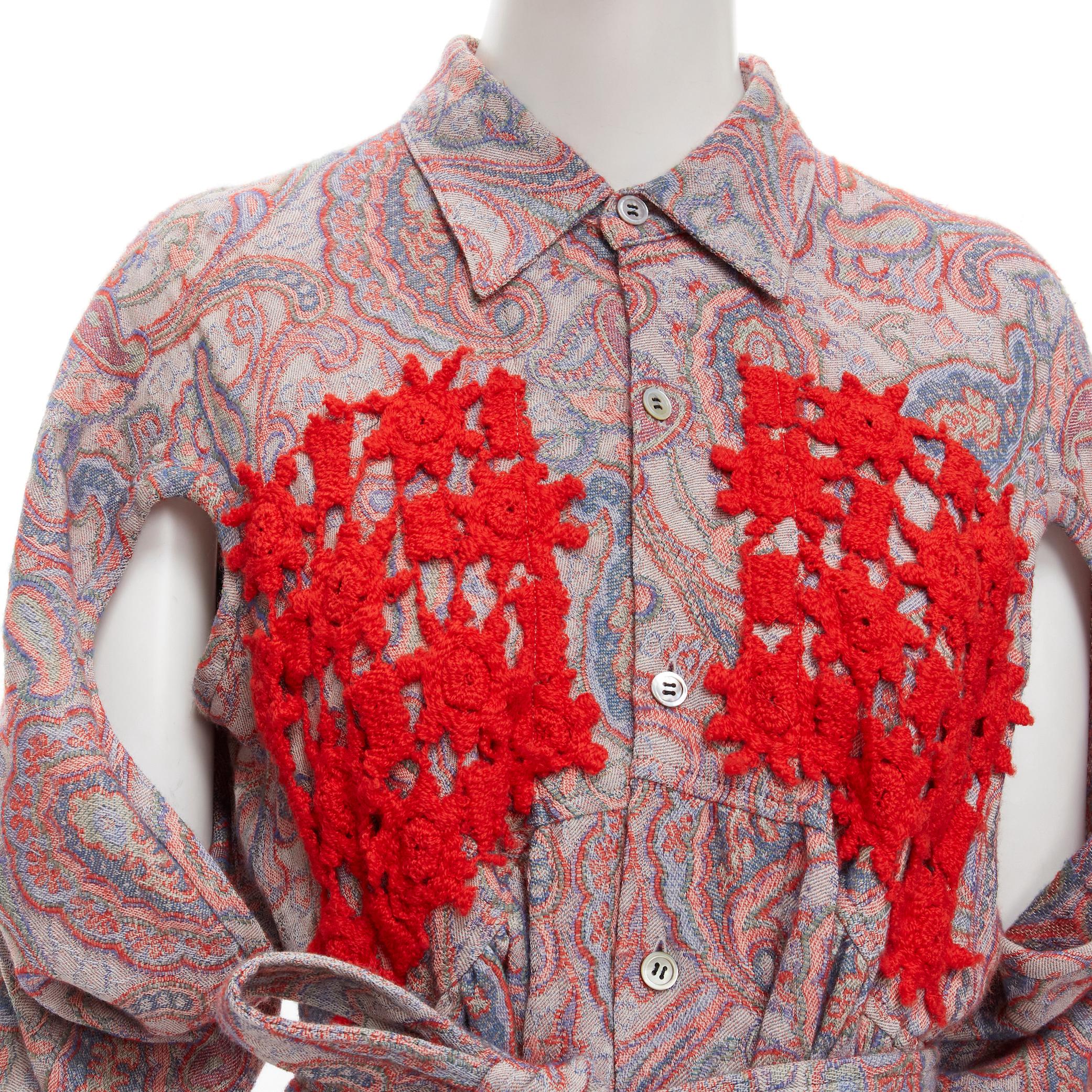 vintage COMME DES GARCONS 1988 red paisley embroidered belted moumou dress M 
Reference: CRTI/A00556 
Brand: Comme Des Garcons 
Designer: Rei Kawakubo 
Collection: 1988 
Material: Wool 
Color: Red 
Pattern: Paisley 
Closure: Button 
Extra Detail: