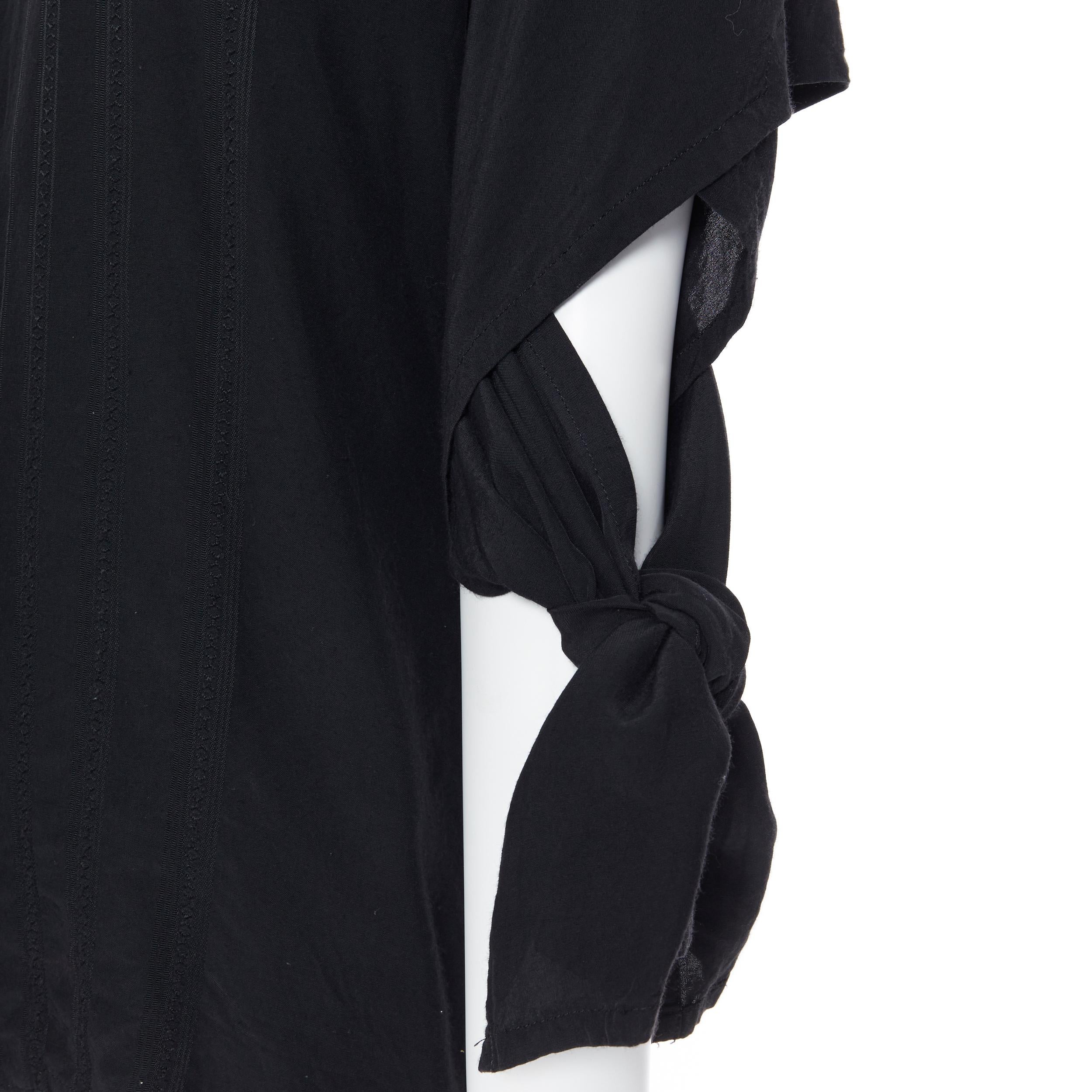 vintage COMME DES GARCONS 1989 black stripe tie arm band asymmetric top S
Brand: Comme Des Garcons
Designer: Rei Kawakubo
Collection: 1989
Model Name / Style: Asymmetric top
Material: Rayon
Color: Black
Pattern: Solid
Closure: Button
Extra Detail: