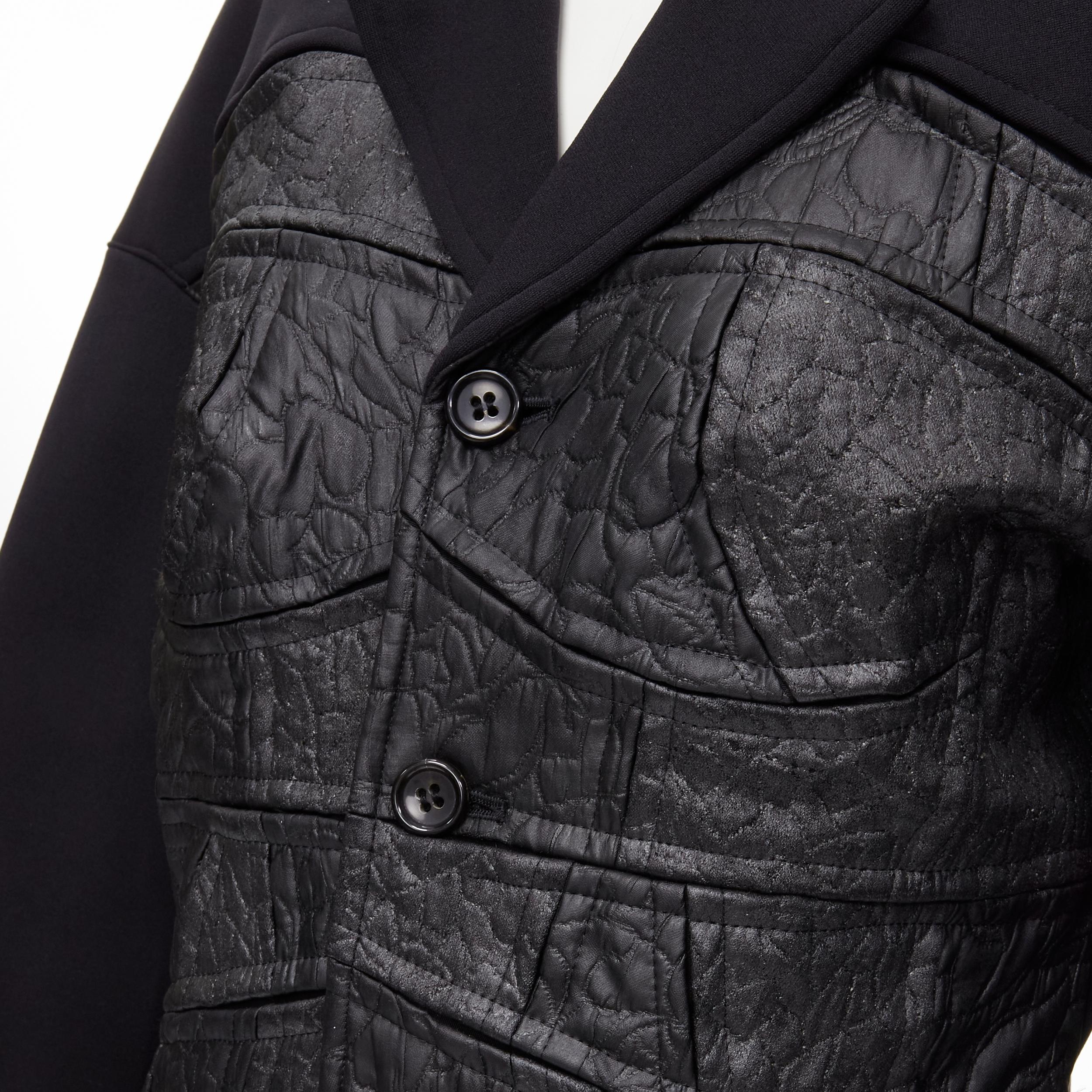 vintage COMME DES GARCONS 1990 black coated patchwork scuba blazer jacket S 
Reference: CRTI/A00392 
Brand: Comme Des Garcons 
Collection: 1990 
Material: Scuba 
Color: Black 
Pattern: Solid 
Closure: Button 
Extra Detail: Scuba body. Coated