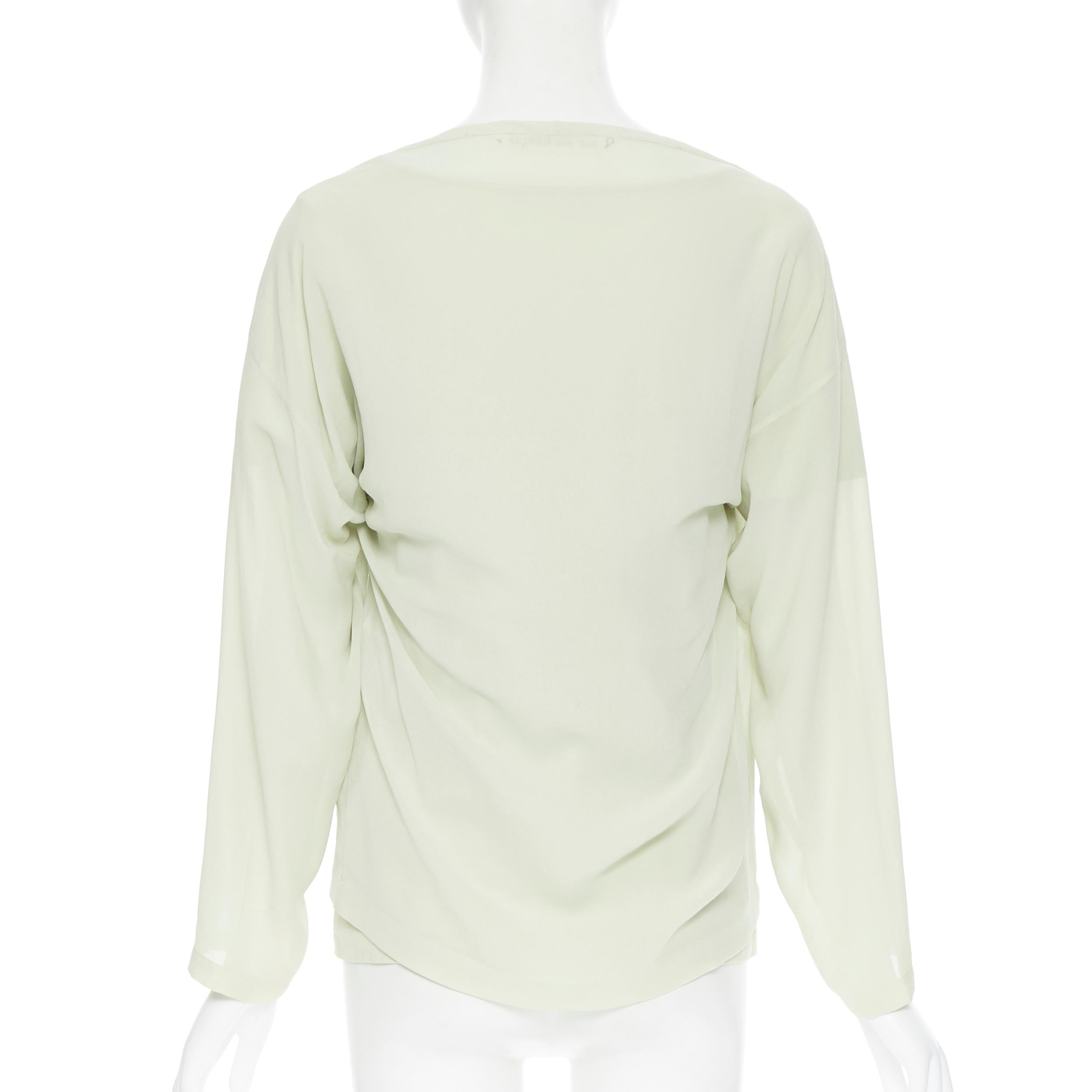 white and green comme des garcons shirt