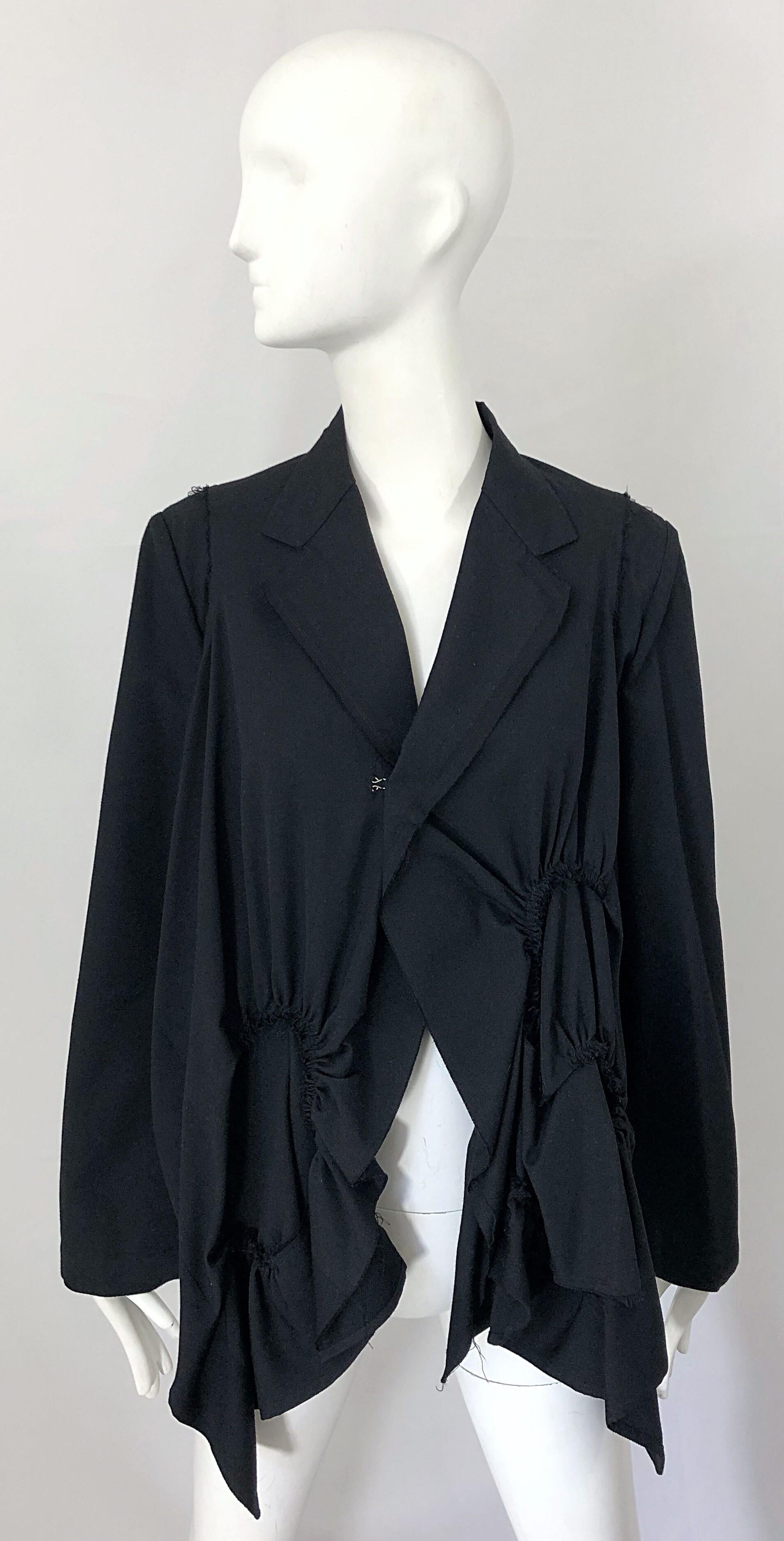 Awesome mid 90s COMME DES GARCONS black vintage Avant Garde trapeze swing jacket! There was so much work and thought put into every detail of this rare gem. Features a single large hook-and-eye closure on the front. Cropped asymmetric back features