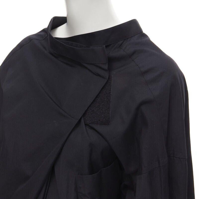 vintage COMME DES GARCONS 1992 black deconstructed magic tape wrap shirt M
Reference: CRTI/A00425
Brand: Comme Des Garcons
Designer: Rei Kawakubo
Collection: 1992
Material: Cotton
Color: Black
Pattern: Solid
Closure: Button
Extra Details: Oversized