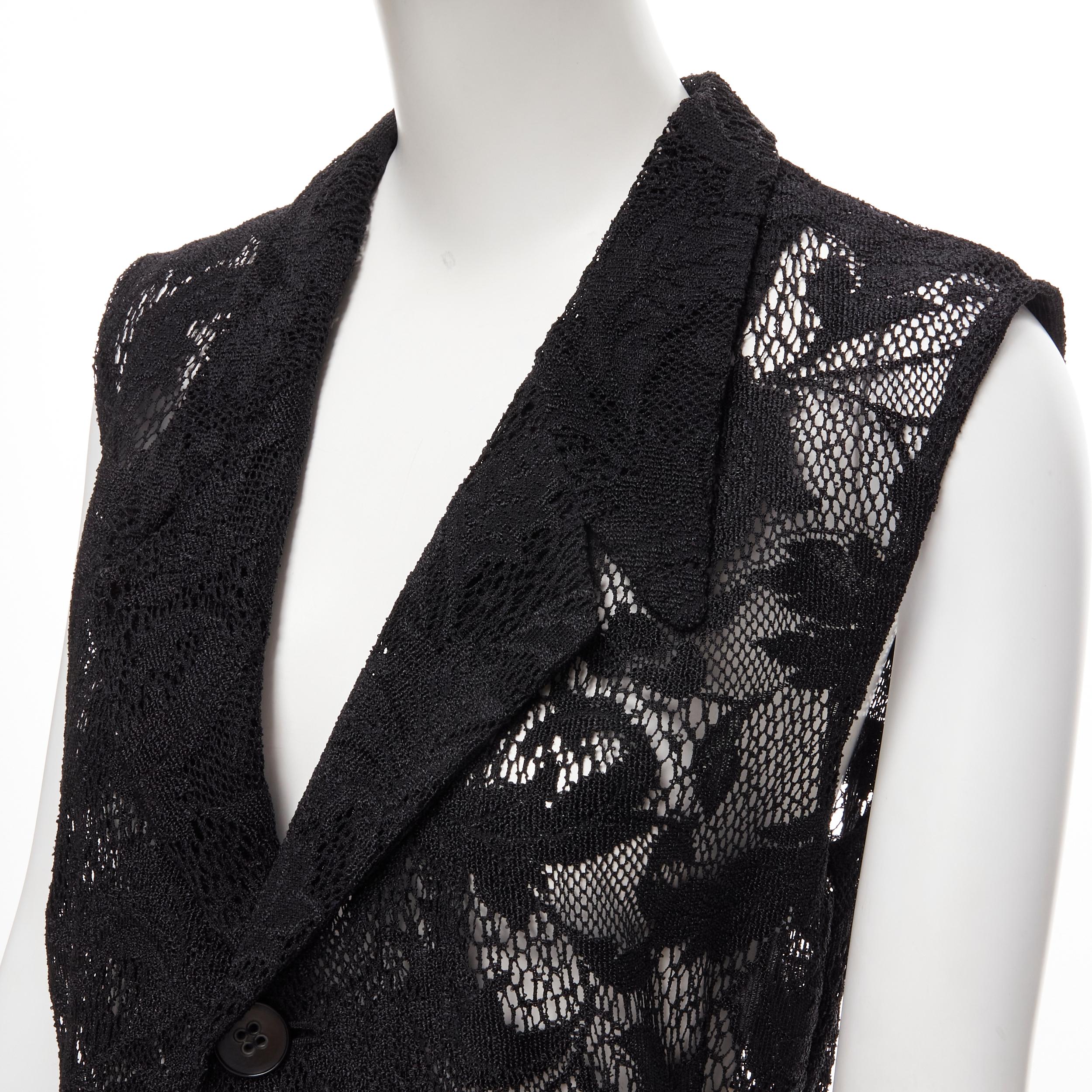 vintage COMME DES GARCONS 1992 black floral lace loose single button long vest S 
Reference: CRTI/A00429 
Brand: Comme Des Garcons 
Collection: 1992 
Material: Polyester 
Color: Black 
Pattern: Solid 
Closure: Button 
Made in: Japan 

CONDITION: