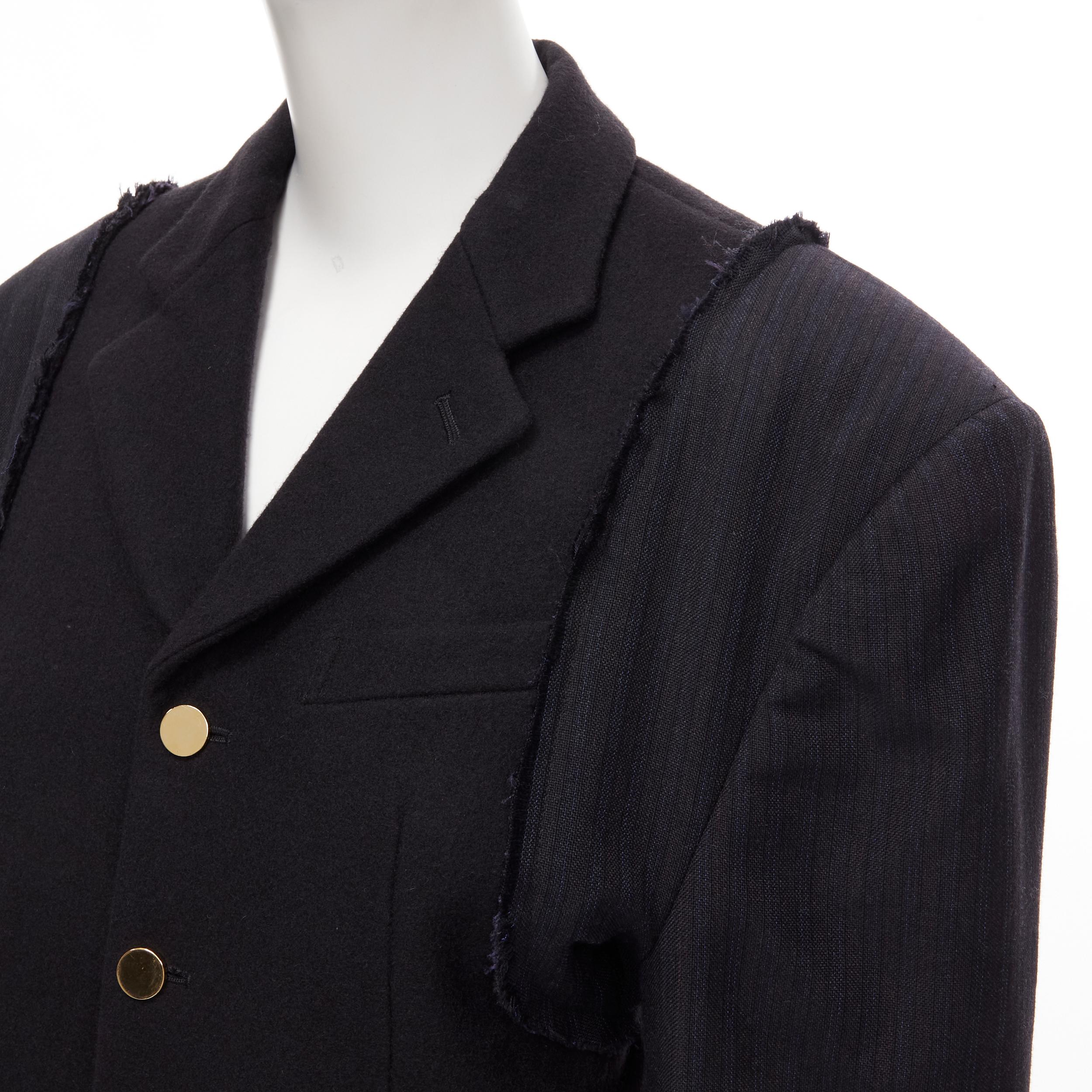 vintage COMME DES GARCONS 1993 black reconstructed shoulder padded blazer M 
Reference: CRTI/A00385 
Brand: Comme Des Garcons 
Collection: 1993 
Material: Wool 
Color: Black 
Pattern: Pinstripe 
Closure: Button 
Extra Detail: Black wool bodice with