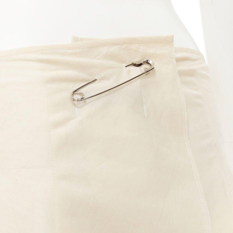 Beige vintage COMME DES GARCONS 1997 beige stacked raw cut rounded pin wrap skirt XS