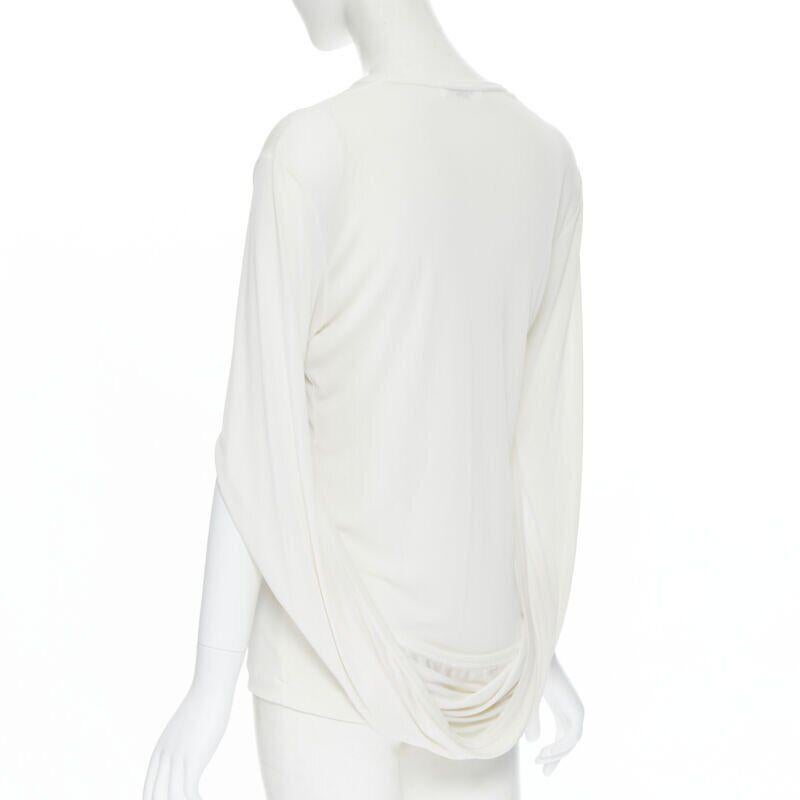 vintage COMME DES GARCONS ROBE DE CHAMBRE 1990 white infinity loop sleeve top S
Reference: CRTI/A00272
Brand: Comme Des Garcons
Designer: Rei Kawakubo
Model: Infinity loop sleeve top
Collection: 1990
Material: Cupro, Polyester
Color: White
Pattern: