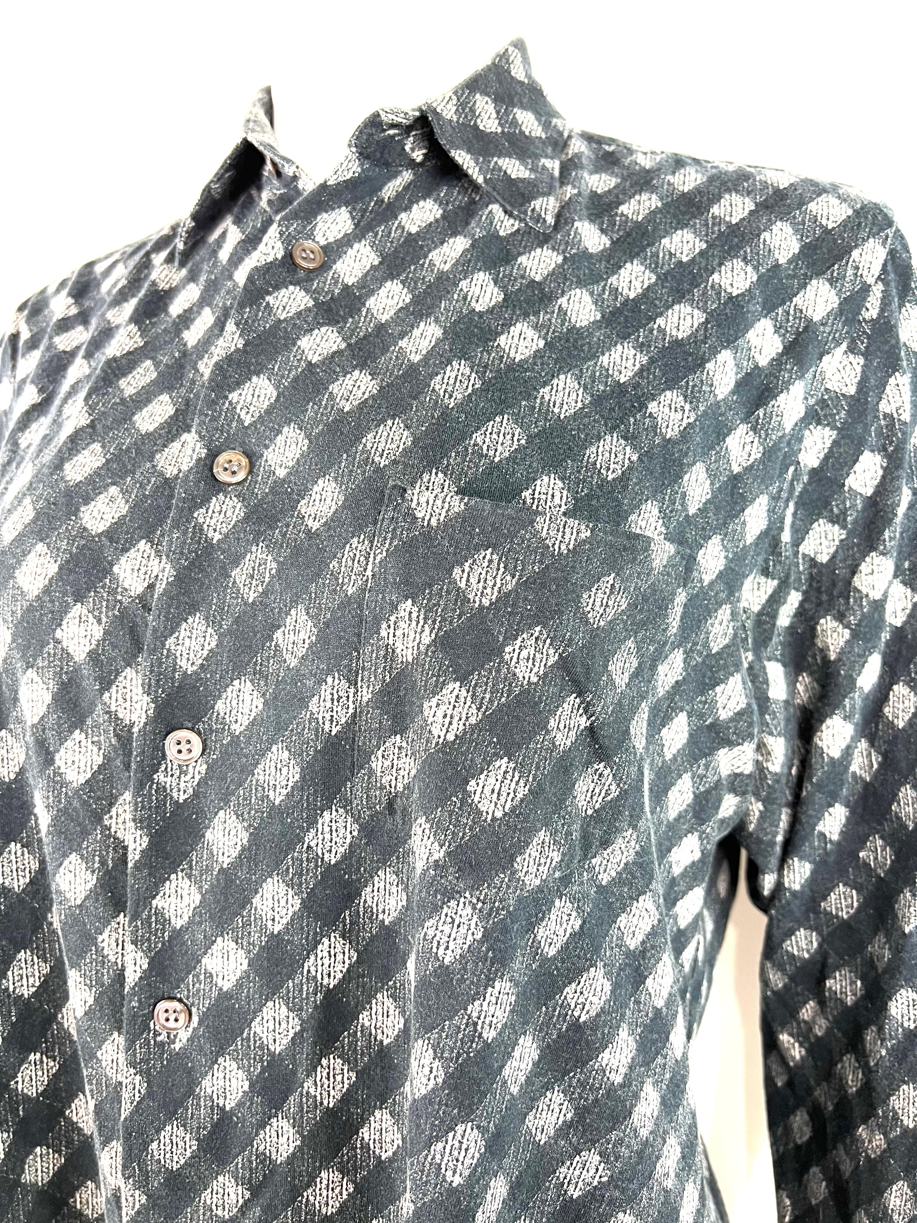 Product details:

The shirt features black and white pattern design, front button closure and side pocket detail. Made in France.