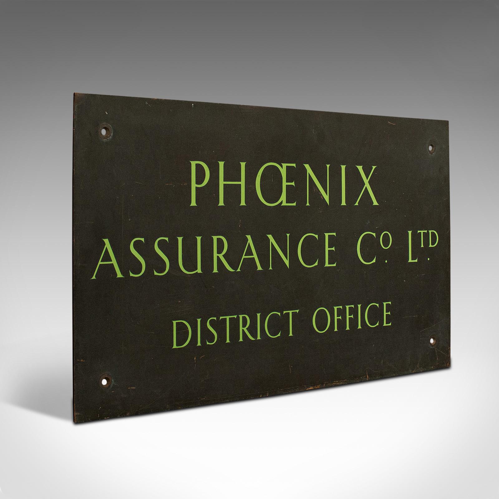 This is a vintage commercial sign. An English, bronze sign-written name plaque for Phoenix Assurance, dating to the mid-20th century, circa 1950.

Solid, elegant commercial sign
Displays a desirable aged patina
Substantial bronze plaque with a