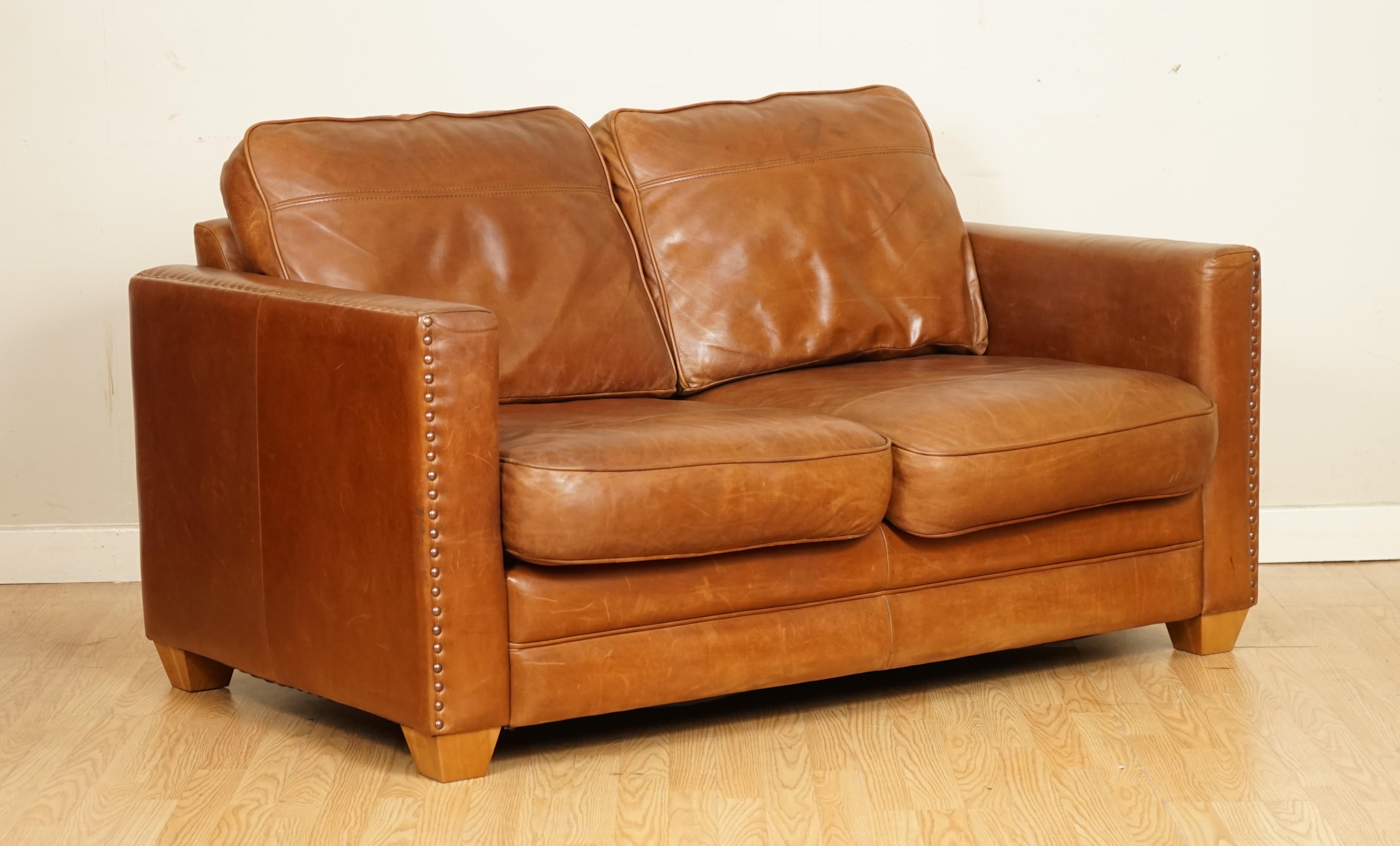We are so excited to present to you this beautiful compact brown leather sofa.

We have lightly restored this by giving it a hand clean all over, hand waxed and hand polish. 

Please carefully look at the pictures to see the condition before
