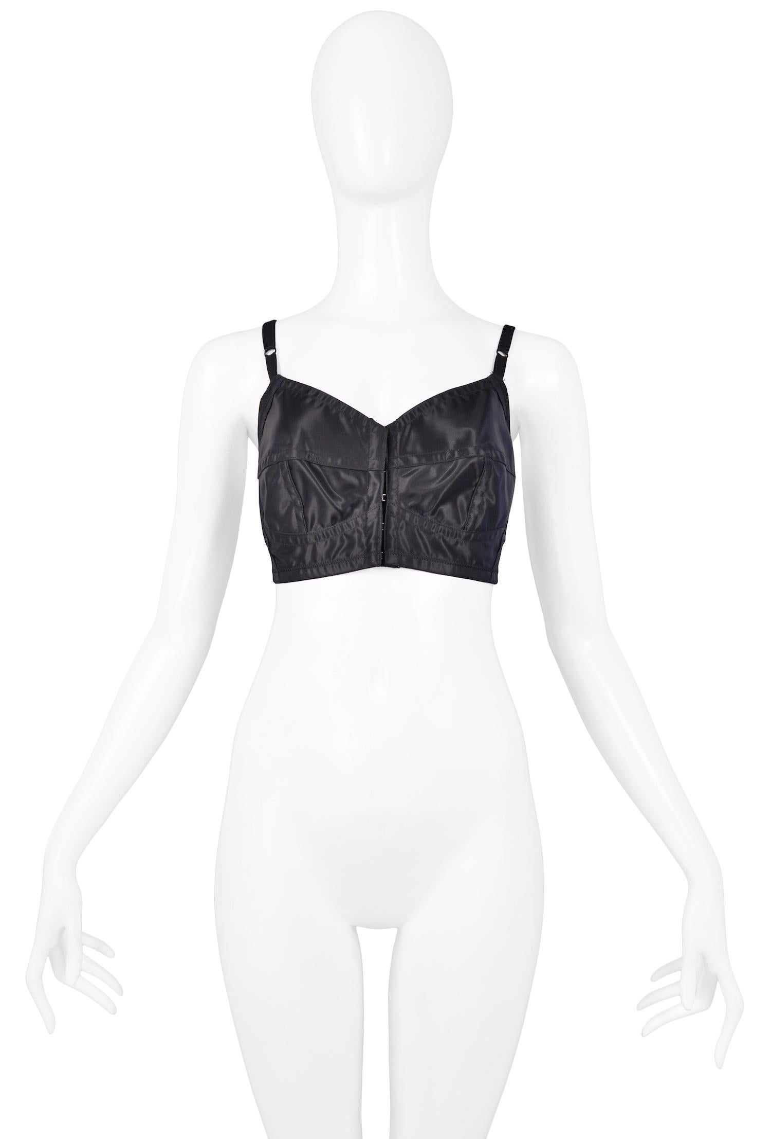 Vintage Complice black satin woven bustier bra top featuring hook and eye closure at front, adjustable straps, and low back. 

Excellent Vintage Condition.

Size: Italian 44
