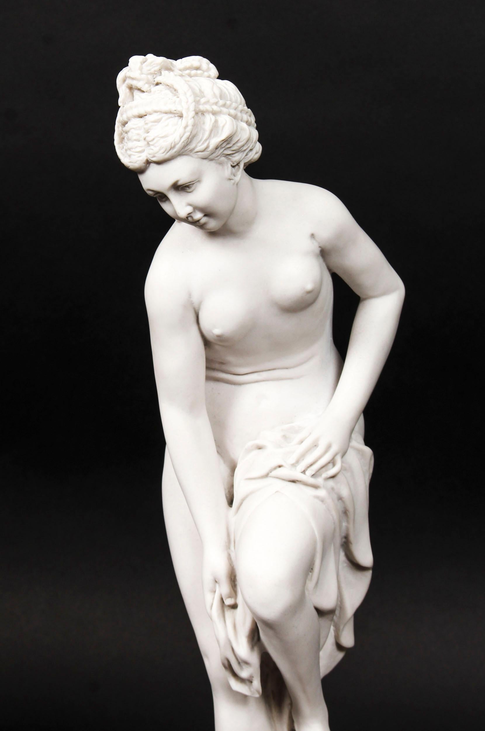 This is a beautifully sculpted composite marble sculpture of a delightful classical maiden figure, late 20th century in date. 
 
This attractive sculpture features the charming maiden with a cloth draped loosely over her left leg. She is