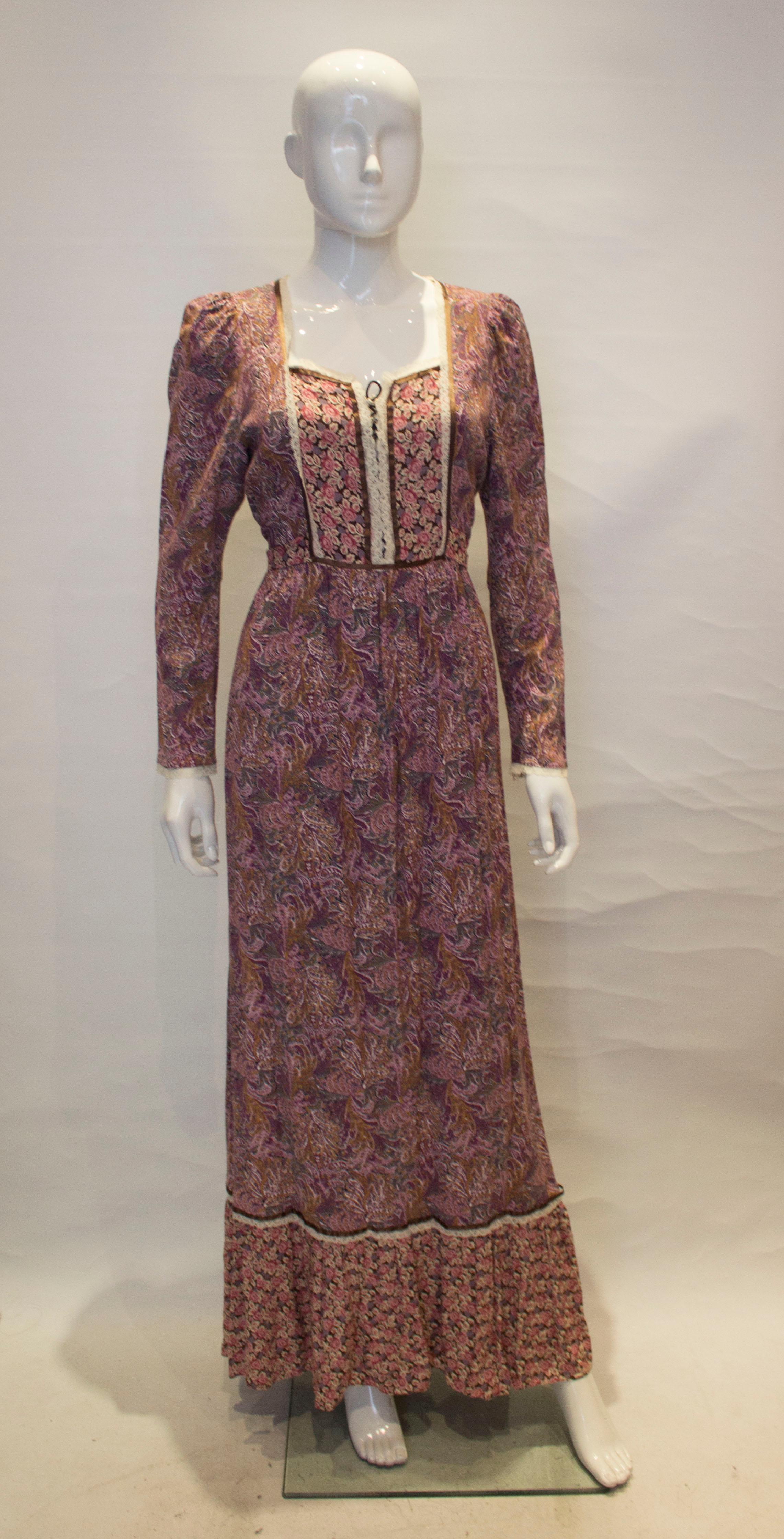 A fun vintage dress by Concepts by Samuel Sherman.  The dress is a great clash of prints, with a lace and lace up detail on the front. It has a central back zip, frill at the hem and sel fabric waist tie.