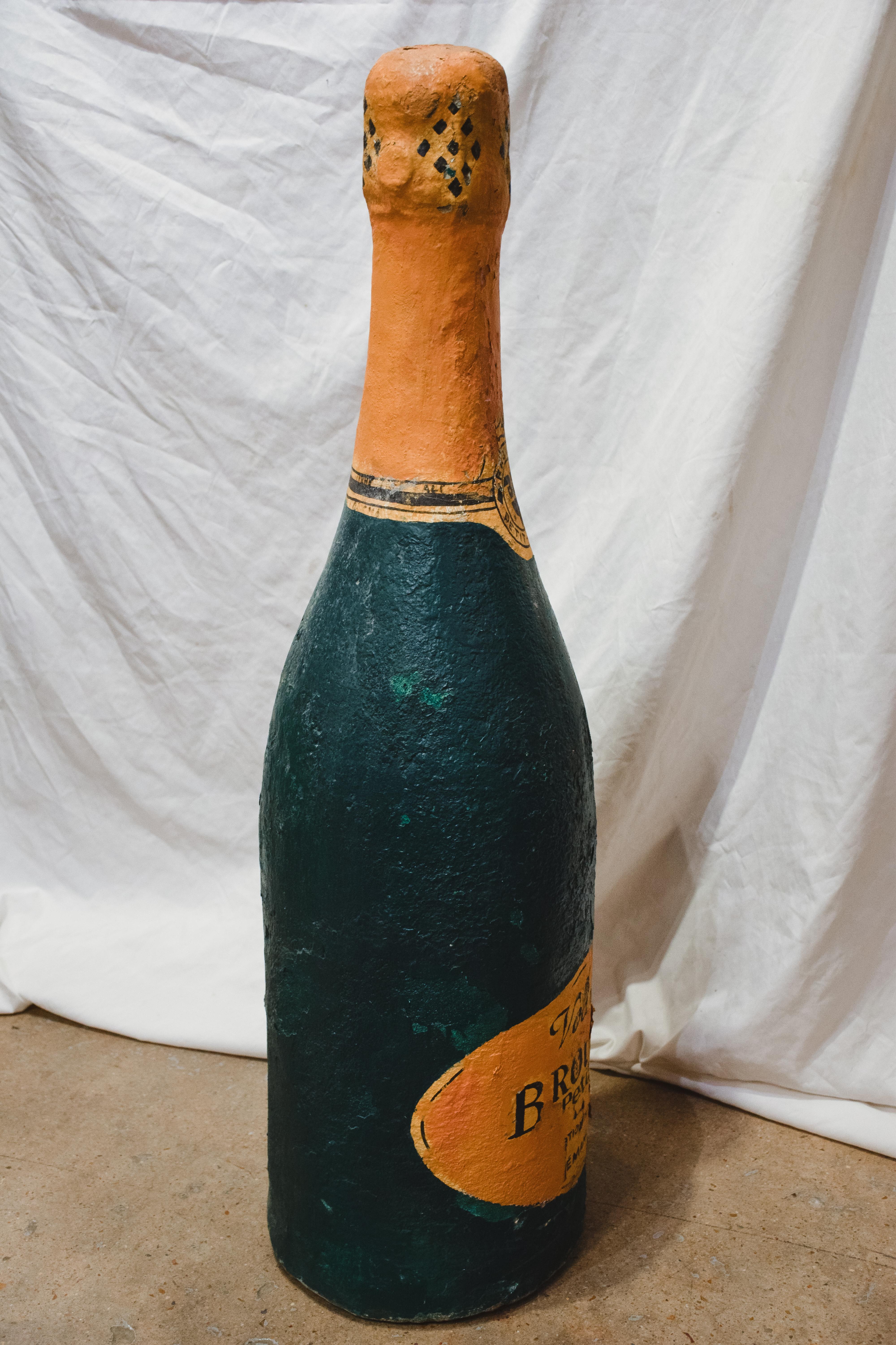 Large, concrete, Brouilly French Sparkling Wine bottle replica. Possibly used as an advertisement or in a prominent spot in the vineyard itself. Would make a great conversation piece as an addition to your wine room.