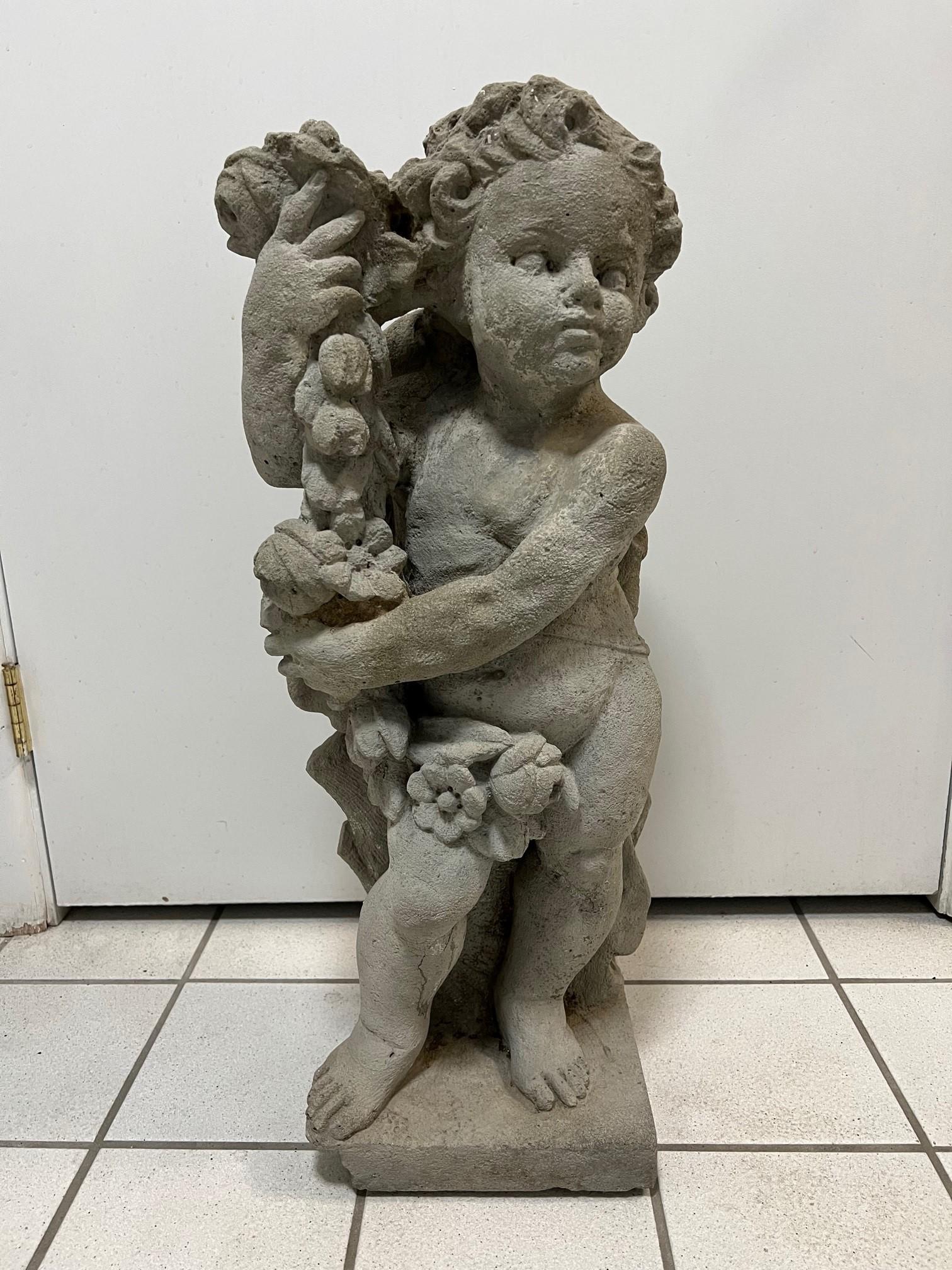 Vintage concrete garden cherub statue Spring, one of the four seasons holding a garland of flowers. Spring is all about new beginnings and transformations, it's a season that symbolizes starting fresh and starting over. This is a cast concrete
