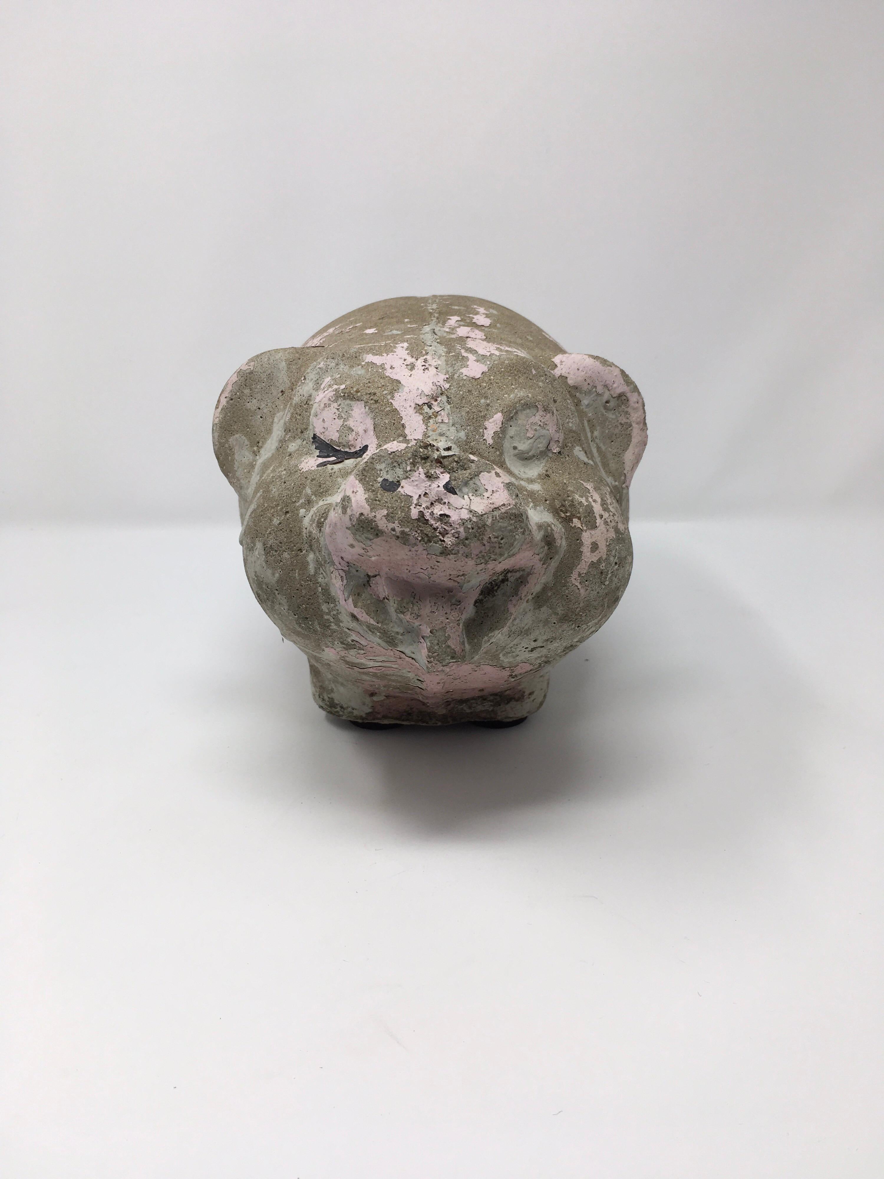 This adorable concrete pig would look great in your garden or indoors. Once painted pink, the paint has worn to a beautiful aged and loved patina.