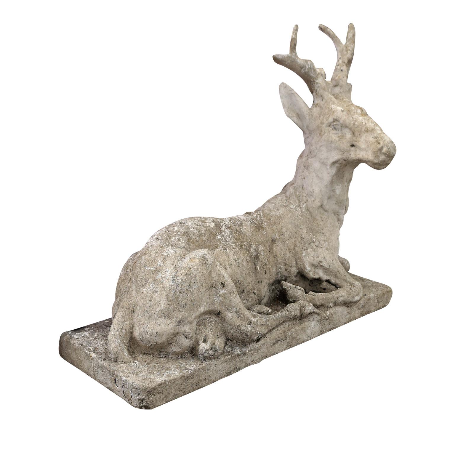 Vintage concrete stag sculpture, a stately depiction of a noble stag at rest, hand-modeled by an anonymous master artist in France using concrete during the early 20th century.