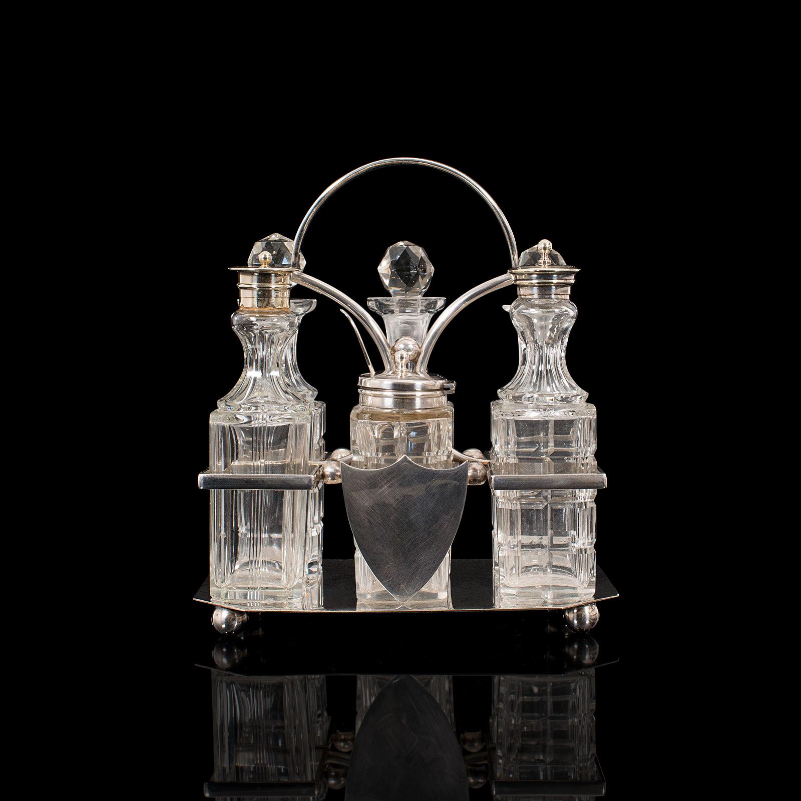 This is a vintage condiment set. An English, silver plated table rack by Robert Pringle & Sons, dating to the early 20th century, circa 1930.

Dashing 6-piece table set
Displaying a desirable aged patina with very light historical marks under