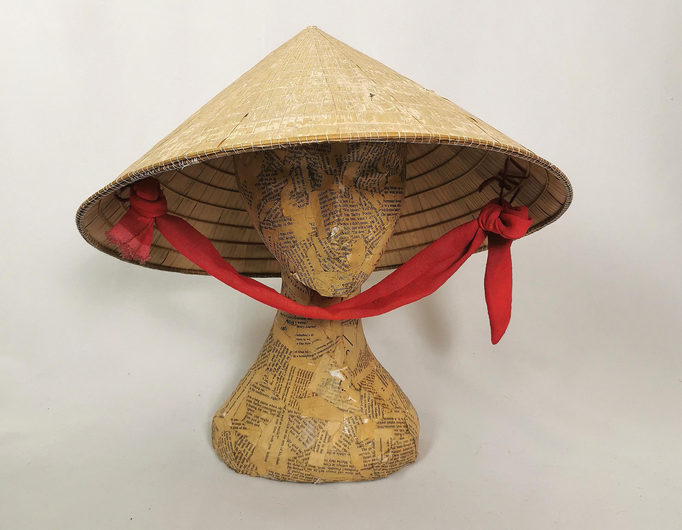 A fantastic vintage original Oriental or Asian sedge hat.

Also known as a coolie hat, these traditional conical straw hats were and are traditionally used for farming or outdoor jobs to protect from the sun and keep your head cool.

The hat is made