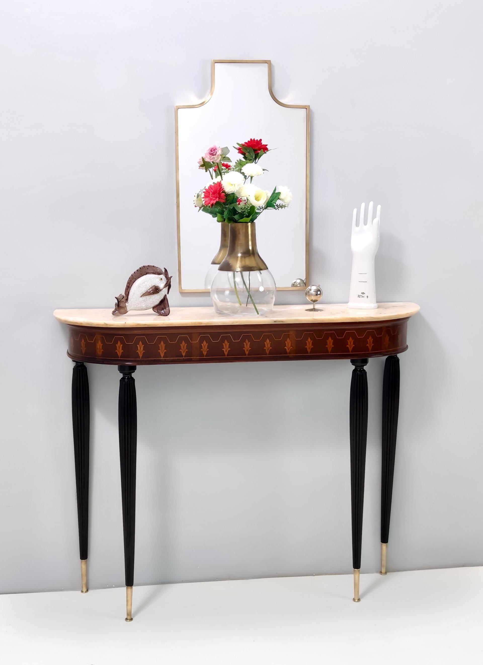 Made in Italy, 1950s.
It features a beech and walnut frame with brass feet caps and a demilune Portuguese pink marble top.
This console may show slight traces of use since it's vintage, but it can be considered as in perfect original condition and