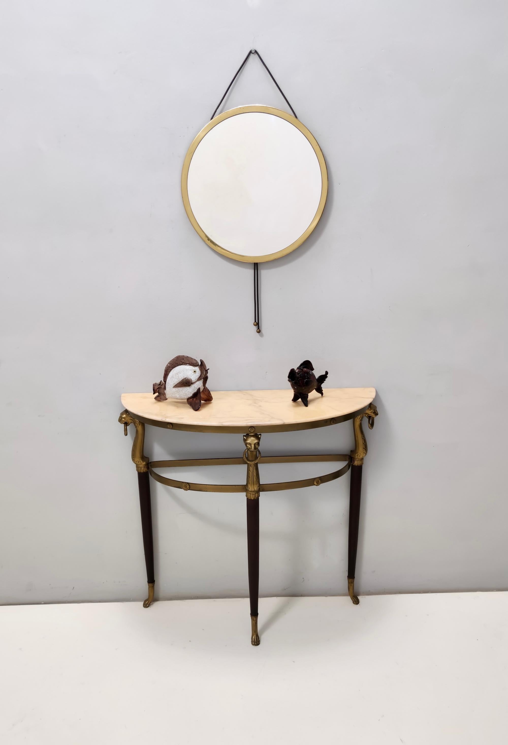 Made in Italy, 1960s. 
This console table features a brass and beech frame and a demilune Portuguese pink marble top. 
It might show slight traces of use since it's vintage, but it can be considered as in excellent original condition and ready to