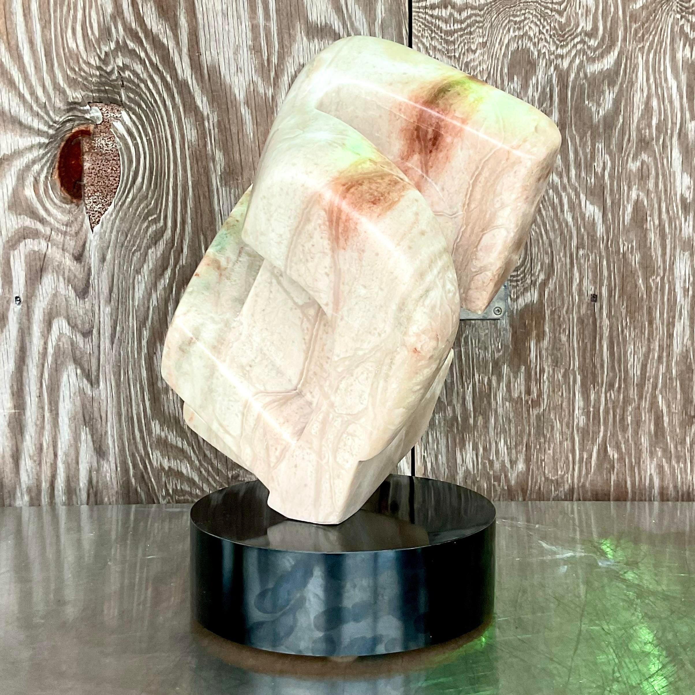 Fantastic vintage Contemporary original stone sculpture. Beautiful solid block with beautiful veining. Rotates on its plinth for optimal views. Acquired from a Palm Beach estate. Unsigned