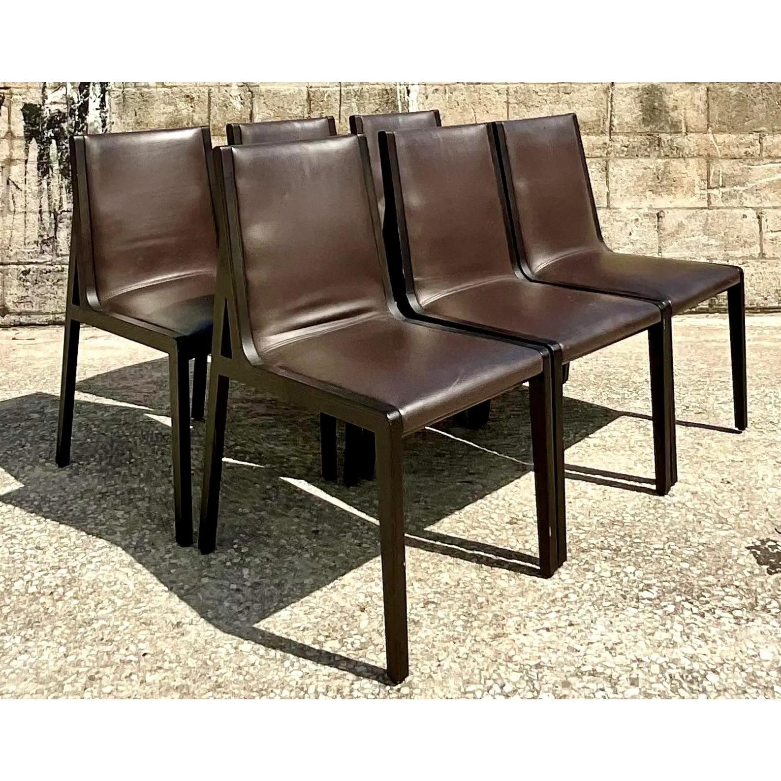 Fantastic set of 6 Camerich dining chairs. The chic Flora design in brown leather and ebony oak. Sleek and sophisticated. Acquired from a Palm Beach estate.