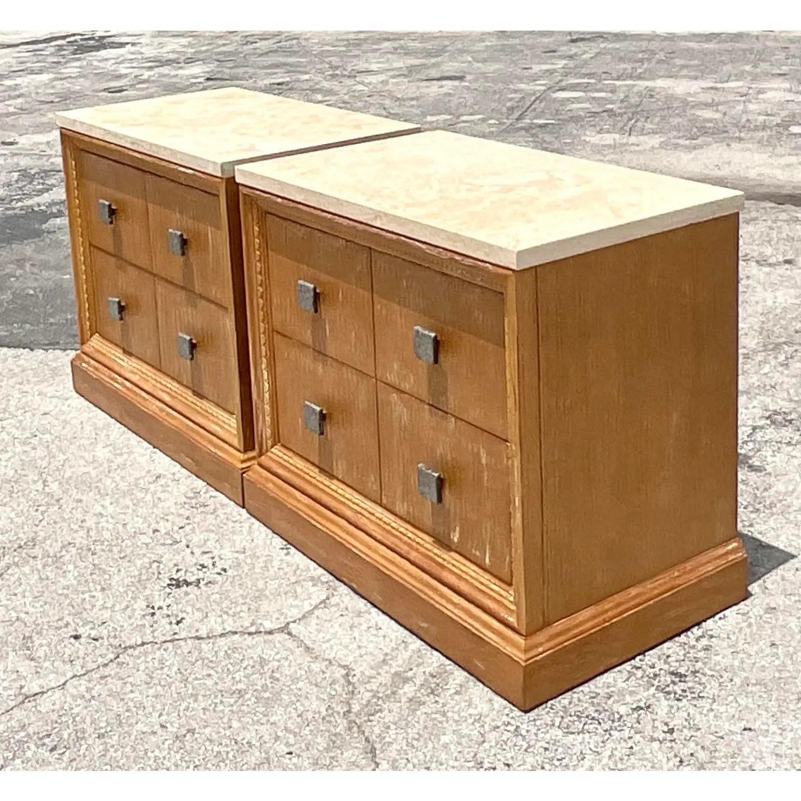 Fantastic vintage pair of Contemporary nightstands. Monumental in size and look. Stone tops and a Cerused oak cabinet. Chic bronze drawer handles. Made by the iconic Century Furniture company. Acquired from a Palm Beach estate.