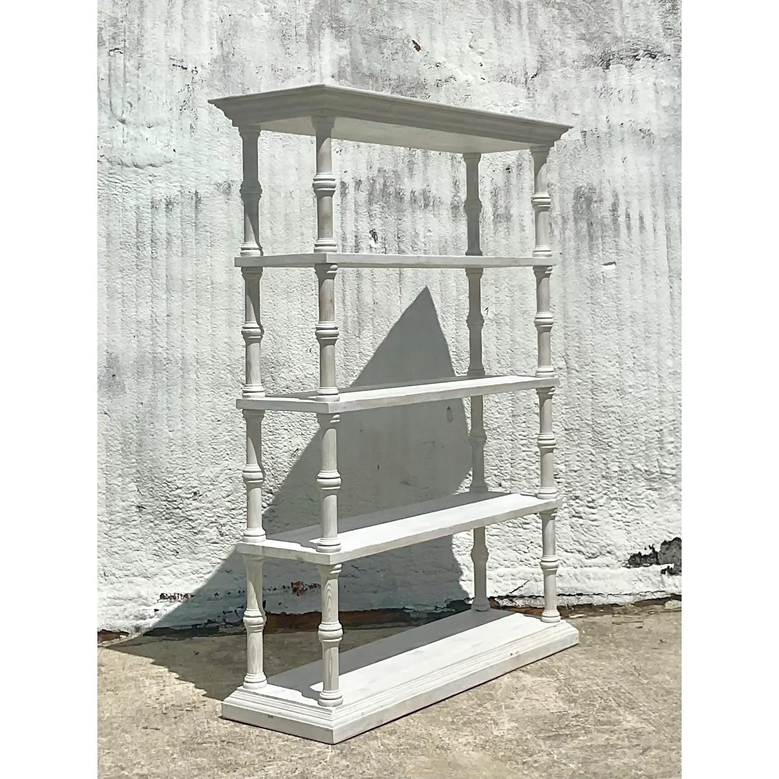 A fantastic vintage tall etagere. Beautiful white cerused finish give it a chic contemporary feel. Monumental in height and drama. Acquired from a Palm Beach estate.