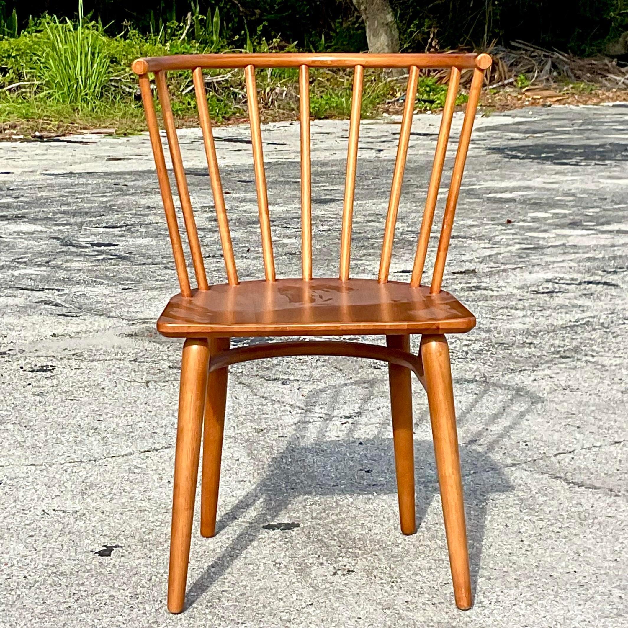 A fabulous vintage Contemporary chair. A chic and simple design with a curved back and thin spoke design. Perfect as a chic occasional chair or even the perfect little desk chair. You decide! Acquired from a Palm Beach estate. 