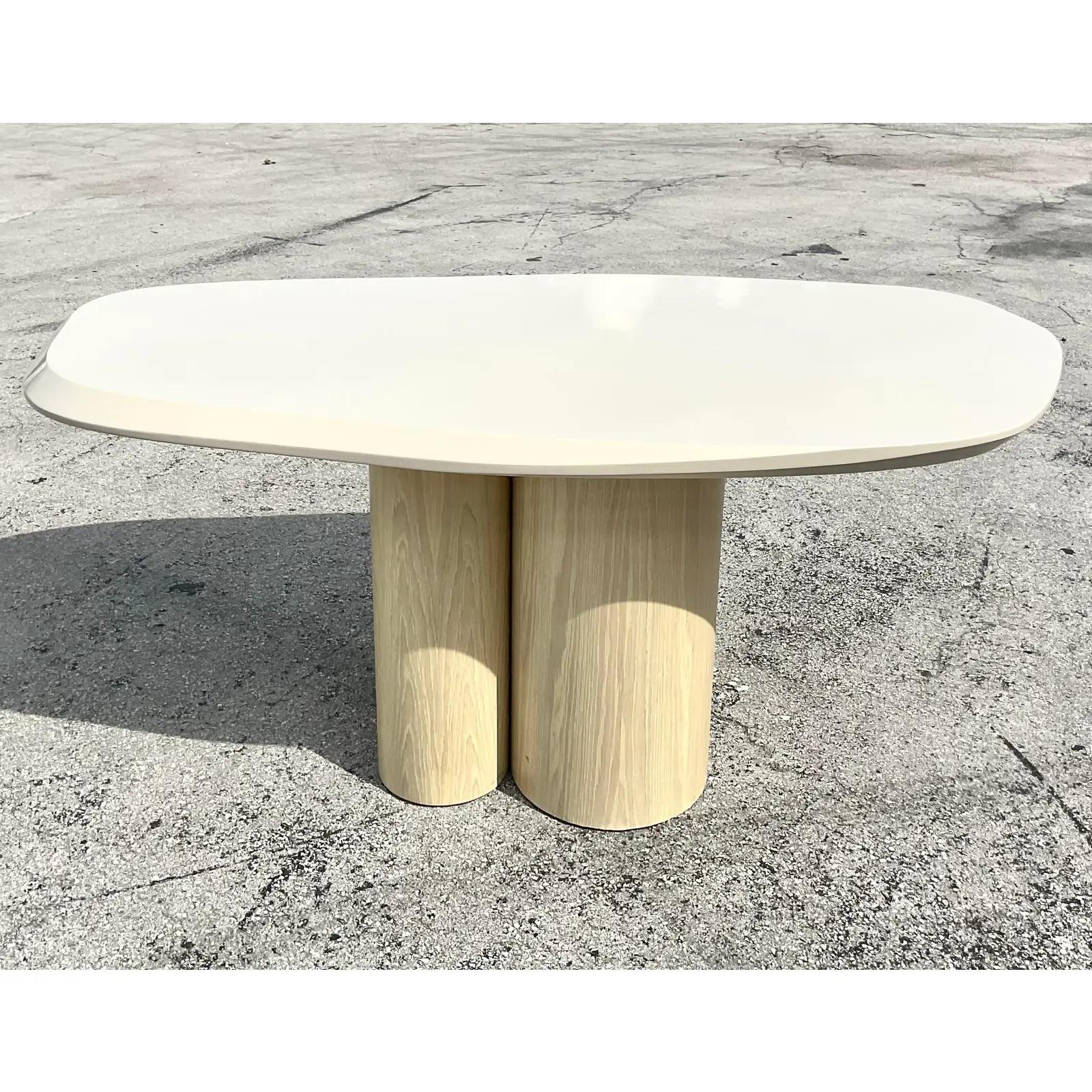 Fabulous vintage Contemporary dining table. Custom built with a chic lacquered top with a faceted edge. Three cerused oak cylinders create the perfect pedestal for such a dramatic top. Acquired from a Palm Beach estate.