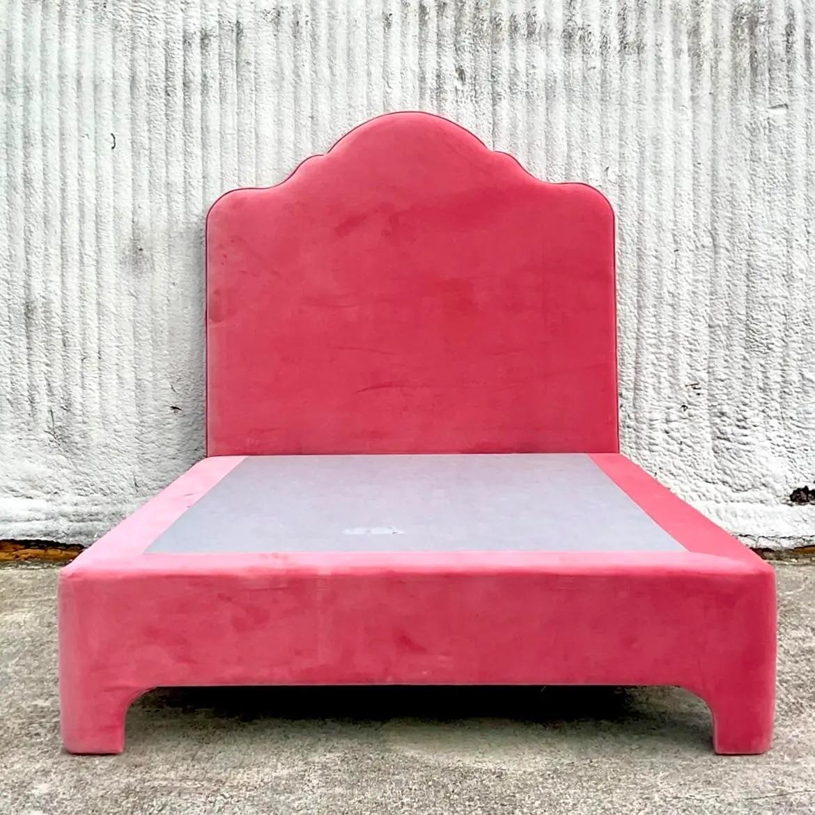 A spectacular vintage Contemporary platform bed. A fabulous hot pink velvet with a high back headboard. Acquired from a Palm Beach estate.