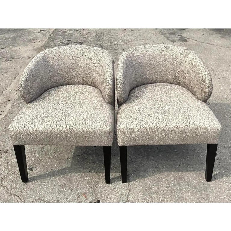 Fantastic pair of custom upholstered side chairs. Beautiful silk pebble boucle is pale greys. A sleek addition to any décor. Acquired from a Palm Beach estate.