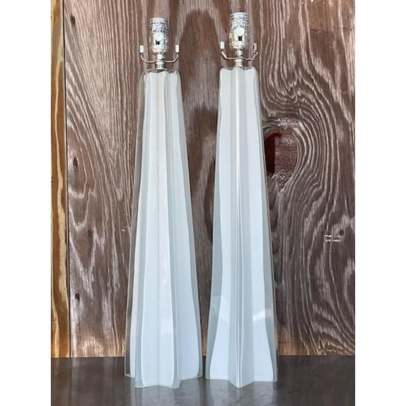 A fabulous pair of vintage Contemporary table lamps. A chic star shape in glass with a painted white interior. Tall and striking. Acquired from a Palm Beach estate.